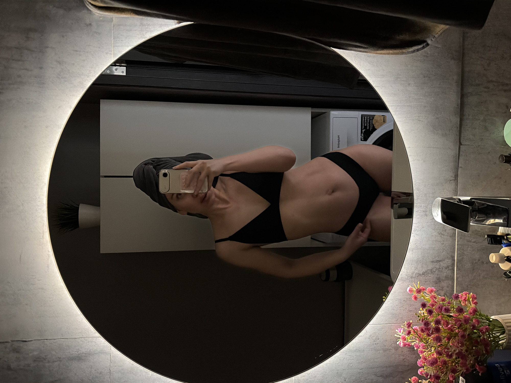 Woman takes bathroom mirror selfies in Chaikovsky, Russia