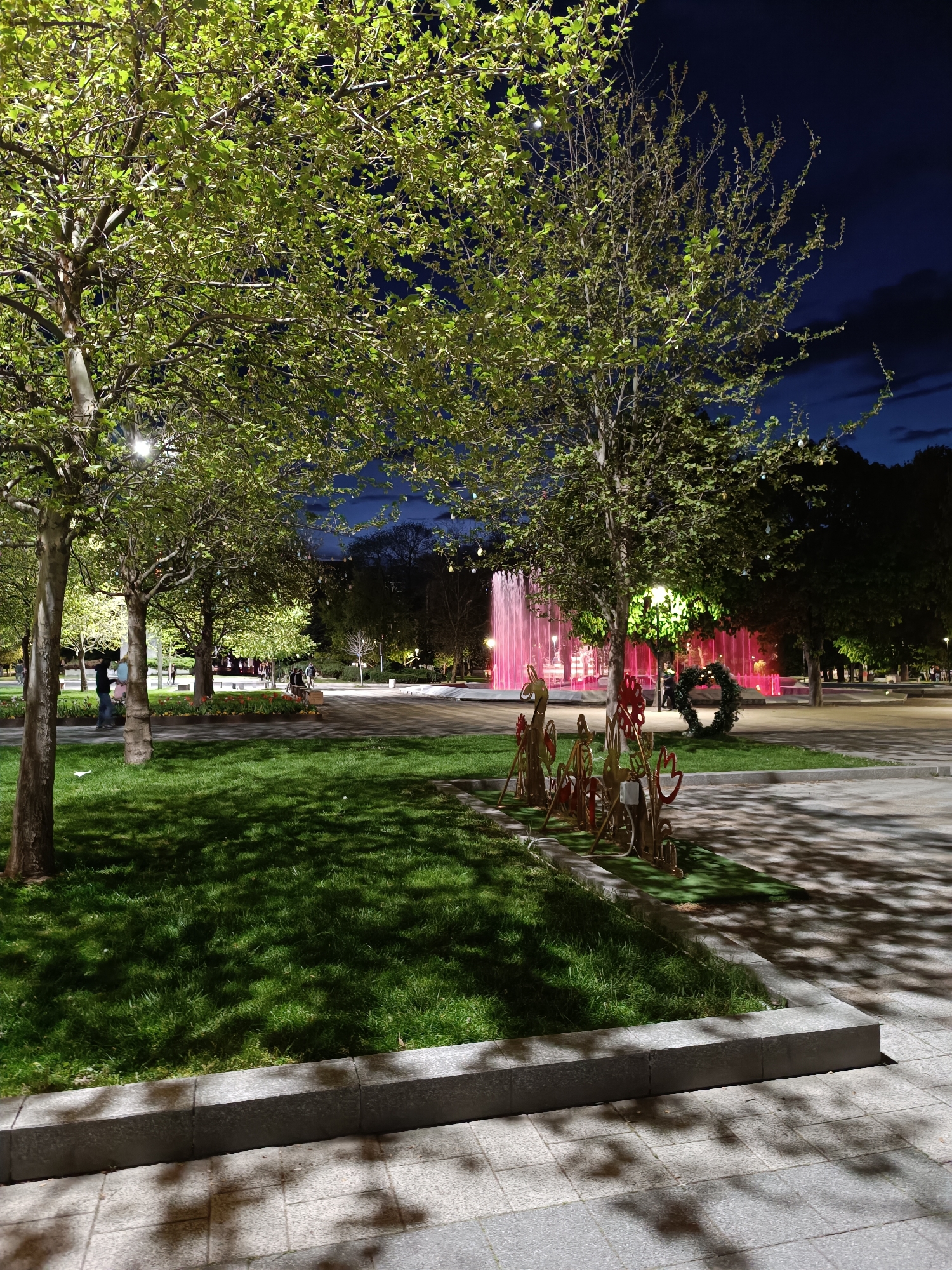 Evening urban walk captures illuminated decorations and street scenes