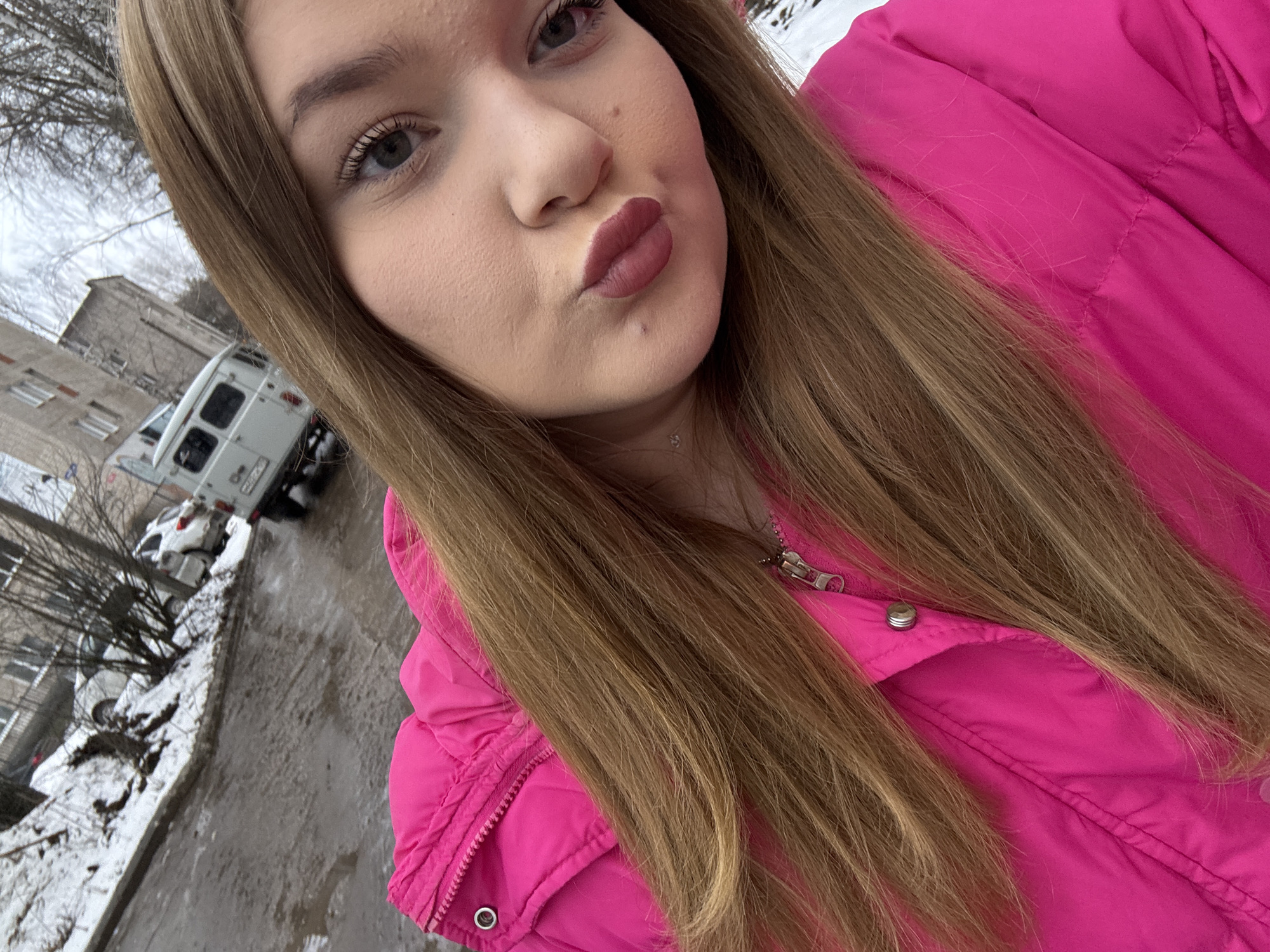 Woman takes winter selfies with dog in Chaikovsky