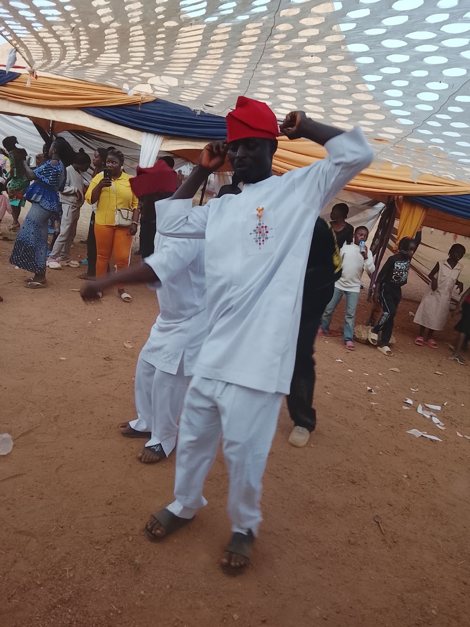 Traditional dancers perform at outdoor cultural gathering