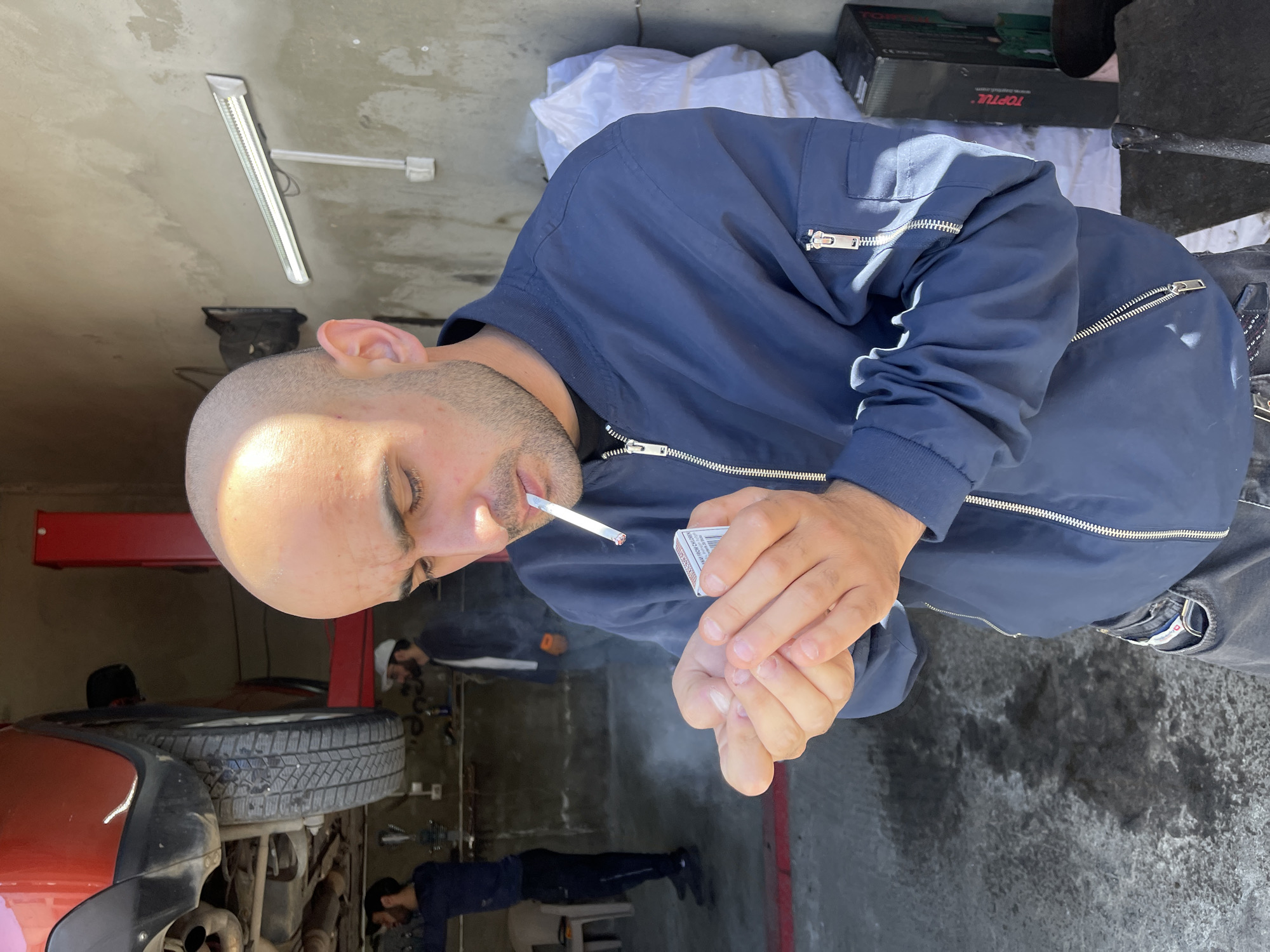 Auto repair work documented at Tbilisi garage facility