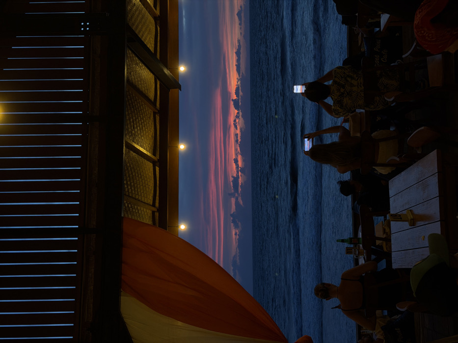 Musical trio performs at Bali beachfront venues during evening