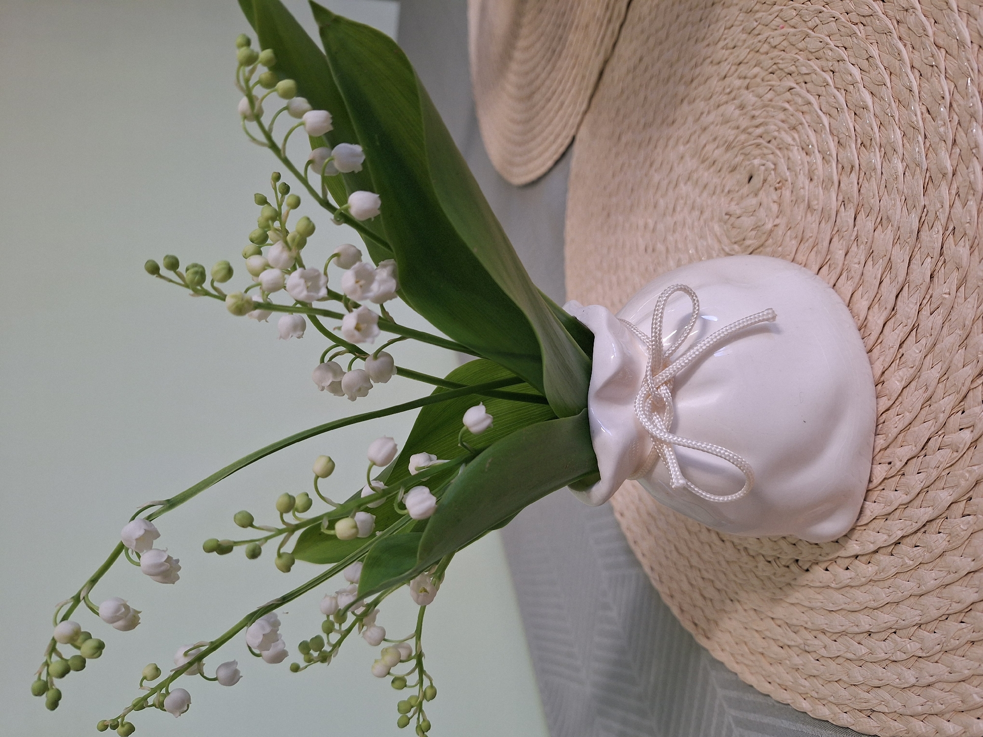 Lily of valley arrangement observed on straw hat in Bulgaria