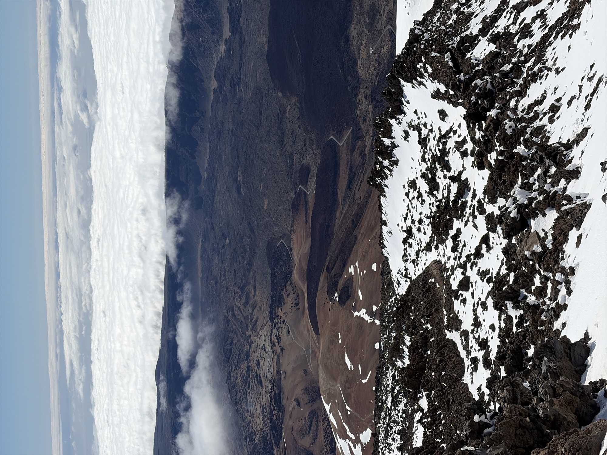 Tourist photographs Mount Teide volcanic landscape from high altitude