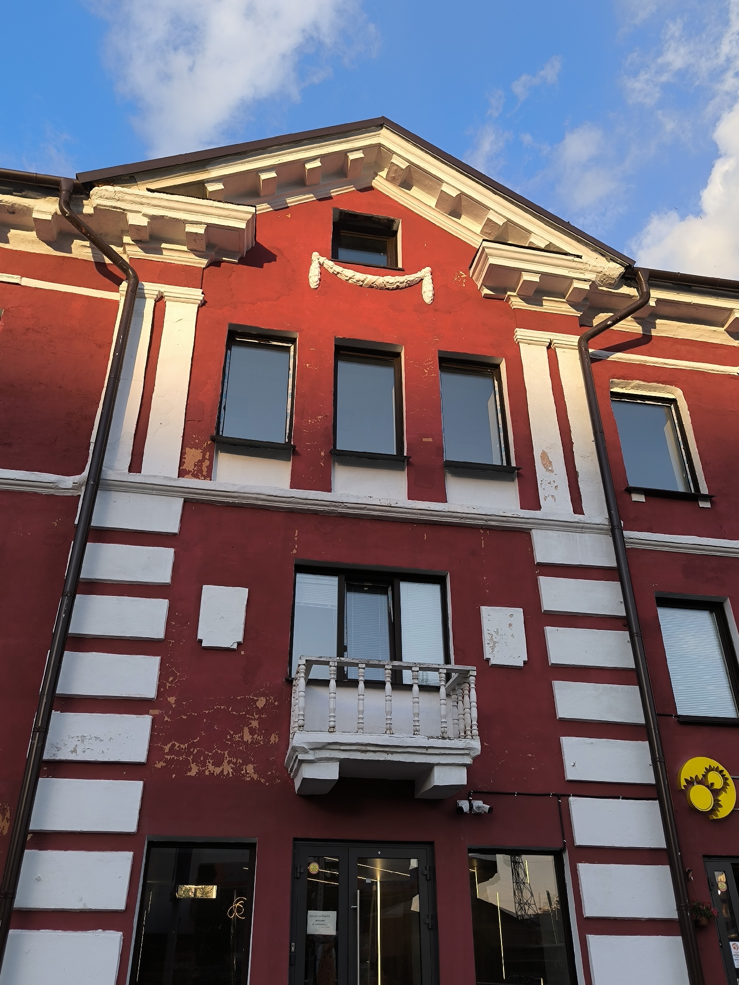 Red ornate building against blue sky in Novosibirsk