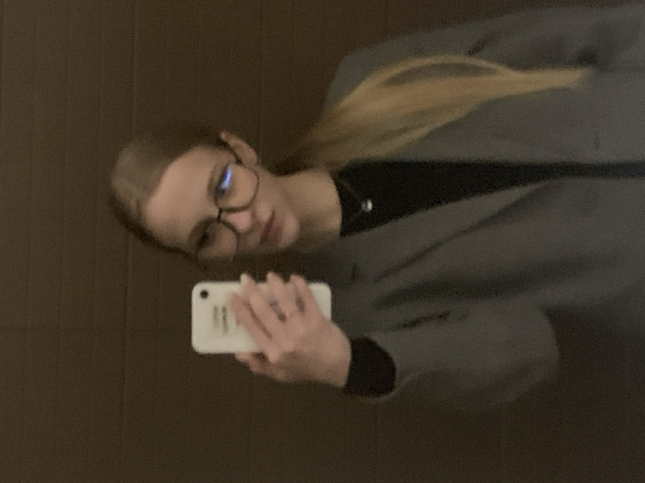 Woman takes multiple selfies in Kyiv mirror session