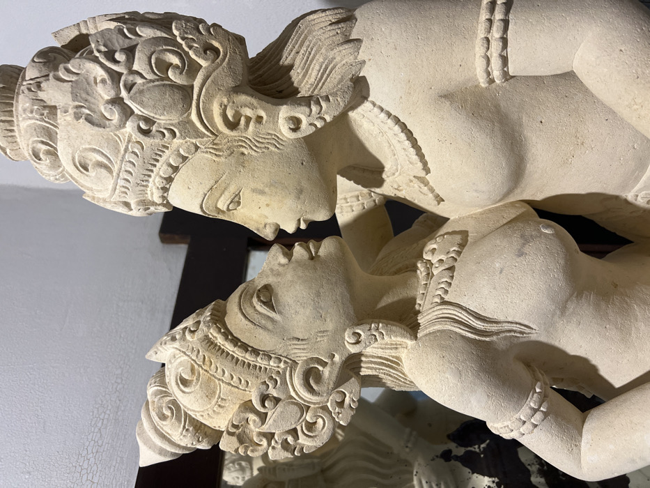Stone statues documented in indoor Ubud location