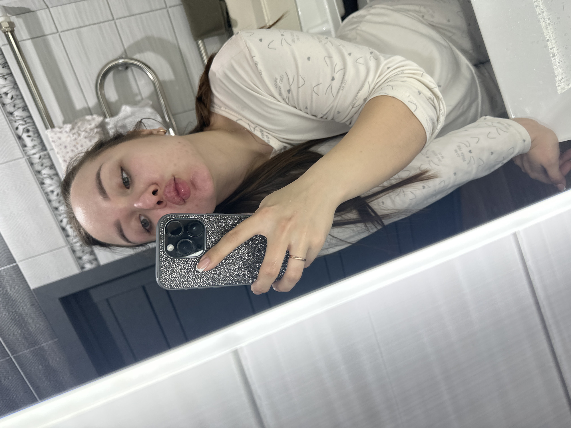 Woman takes morning selfies at home with large dogs