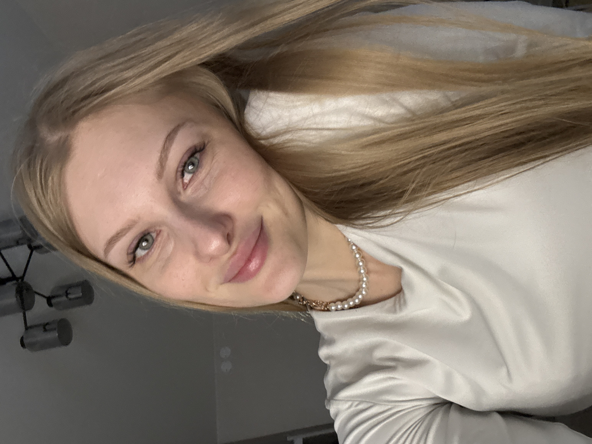 Woman takes selfies during afternoon photo session in Perm