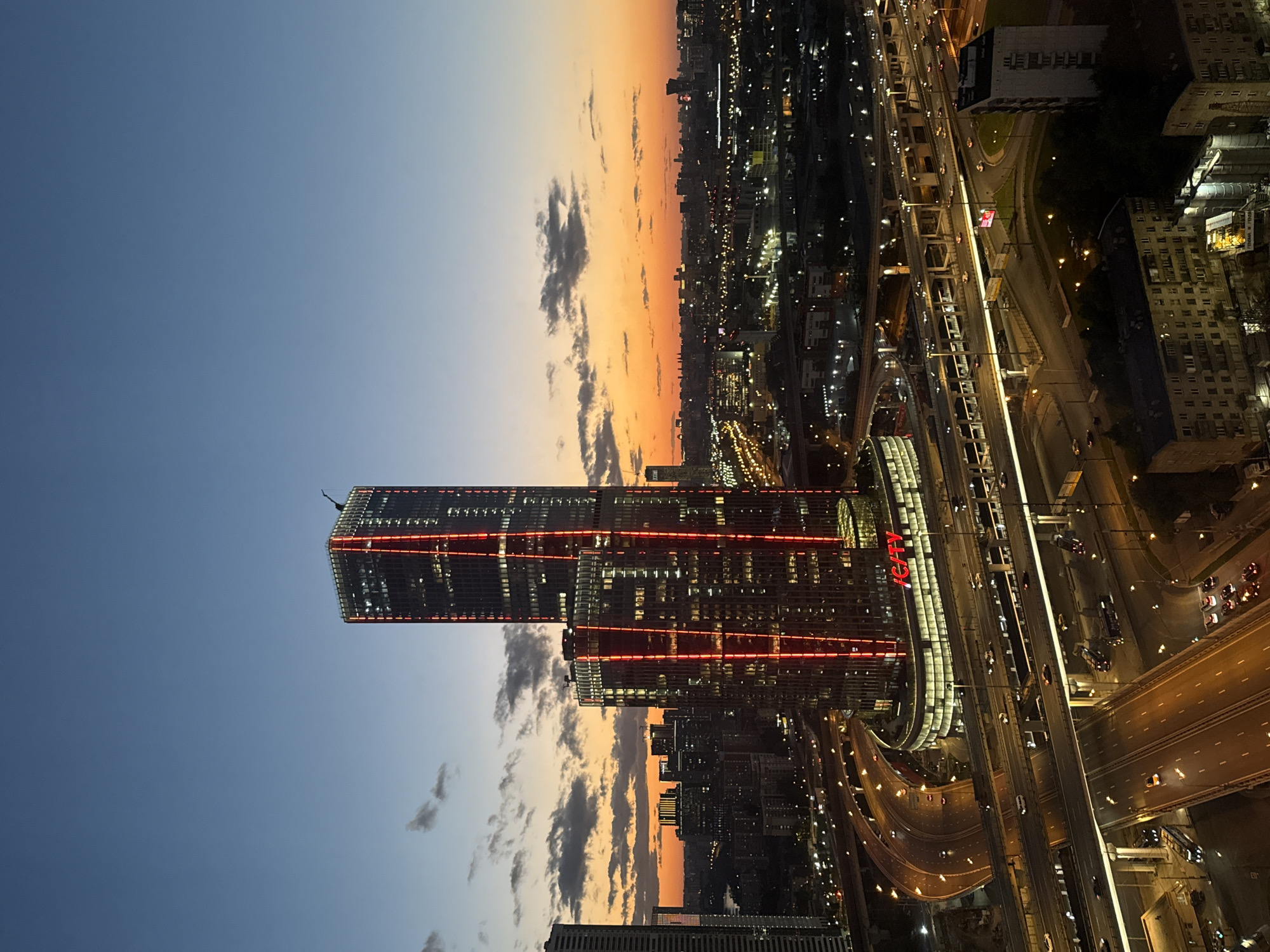 iCity towers glow red against the Khimki twilight