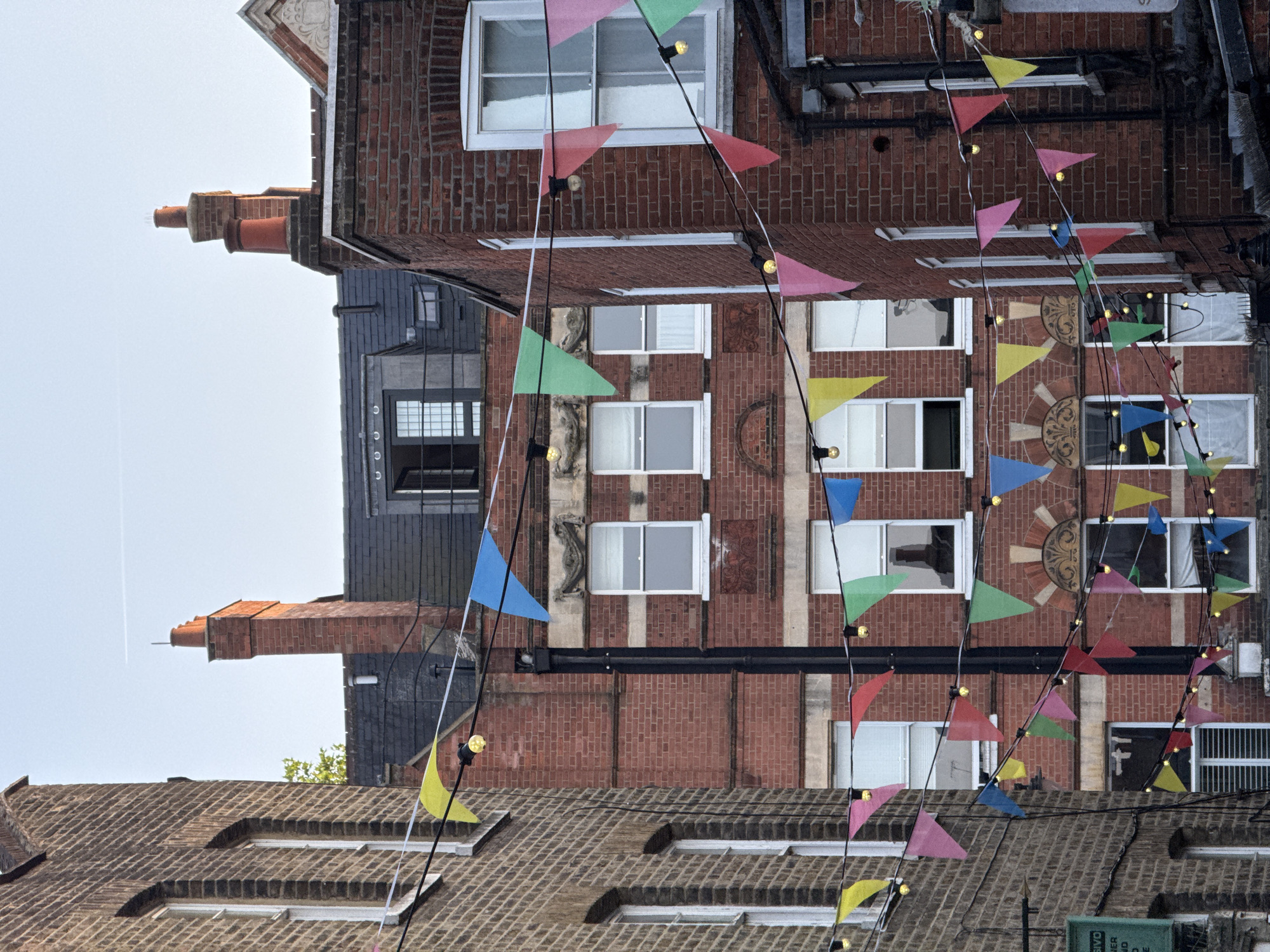 London street hosts casual evening gathering with festive decorations