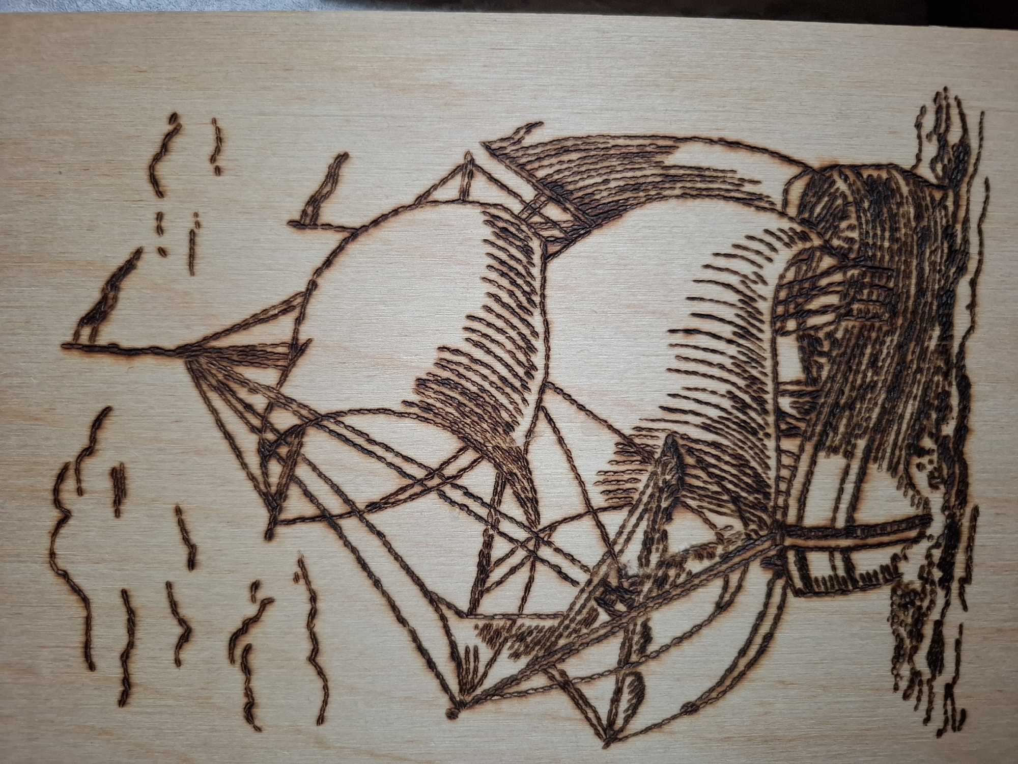 Wood-burning artist creates ship and spacecraft designs in Amzya