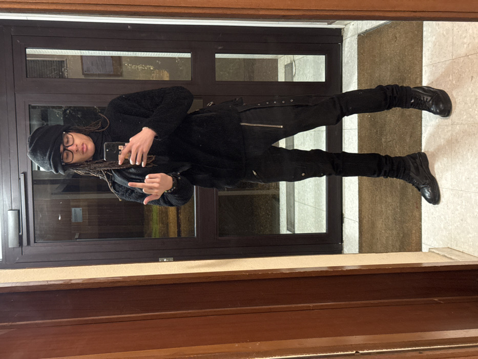 Person in black takes selfies in Les Ulis