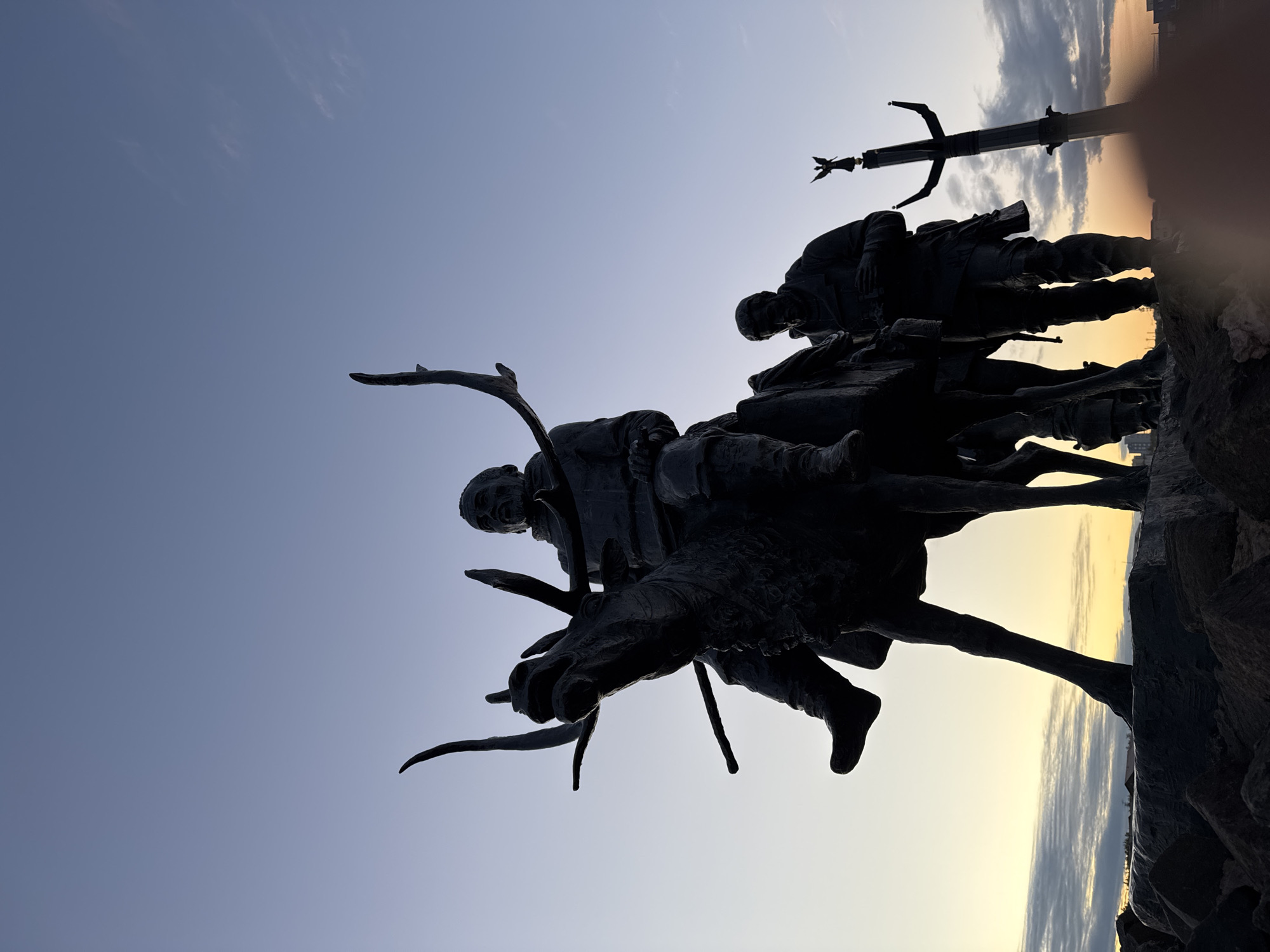 Twilight tour of Mirny's public monuments, reindeer bronze to angel column