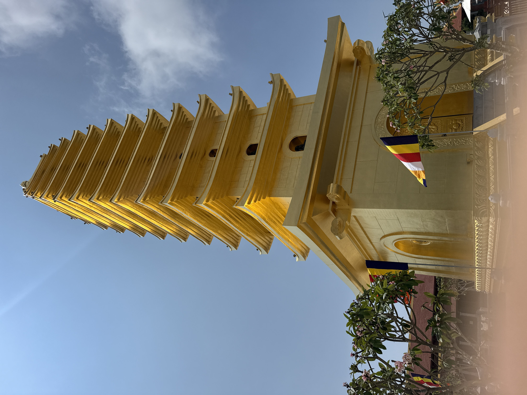 Golden pagoda and temple gate photographed in Diên Khánh