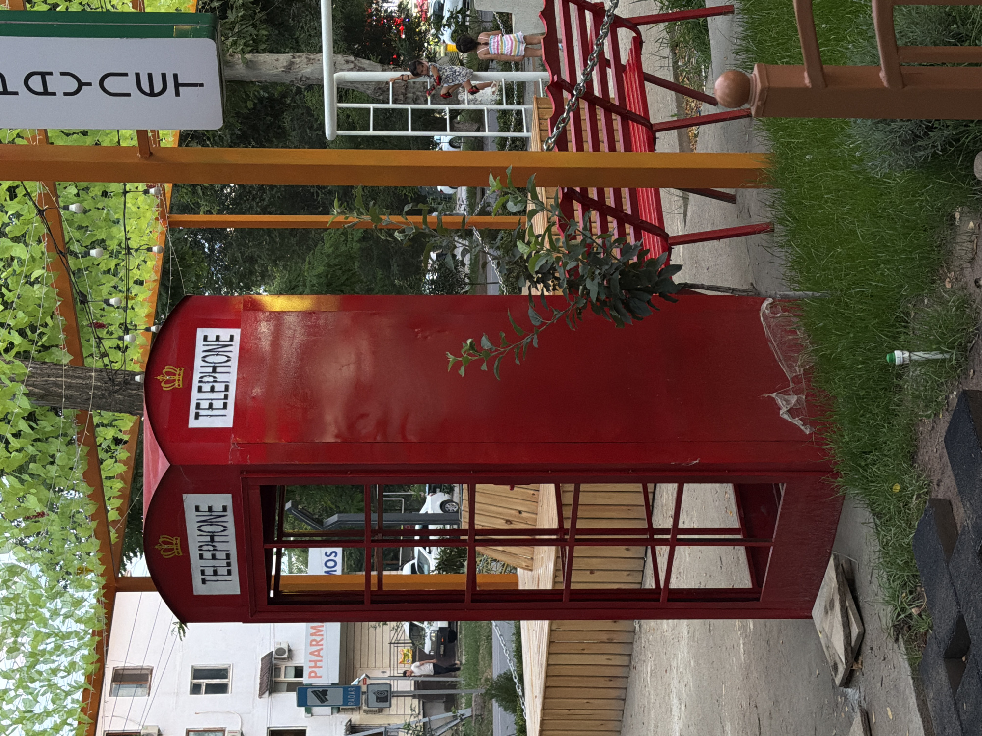 Chirchik's quirky themed promenade: phone booths, horse statues, beer carts.