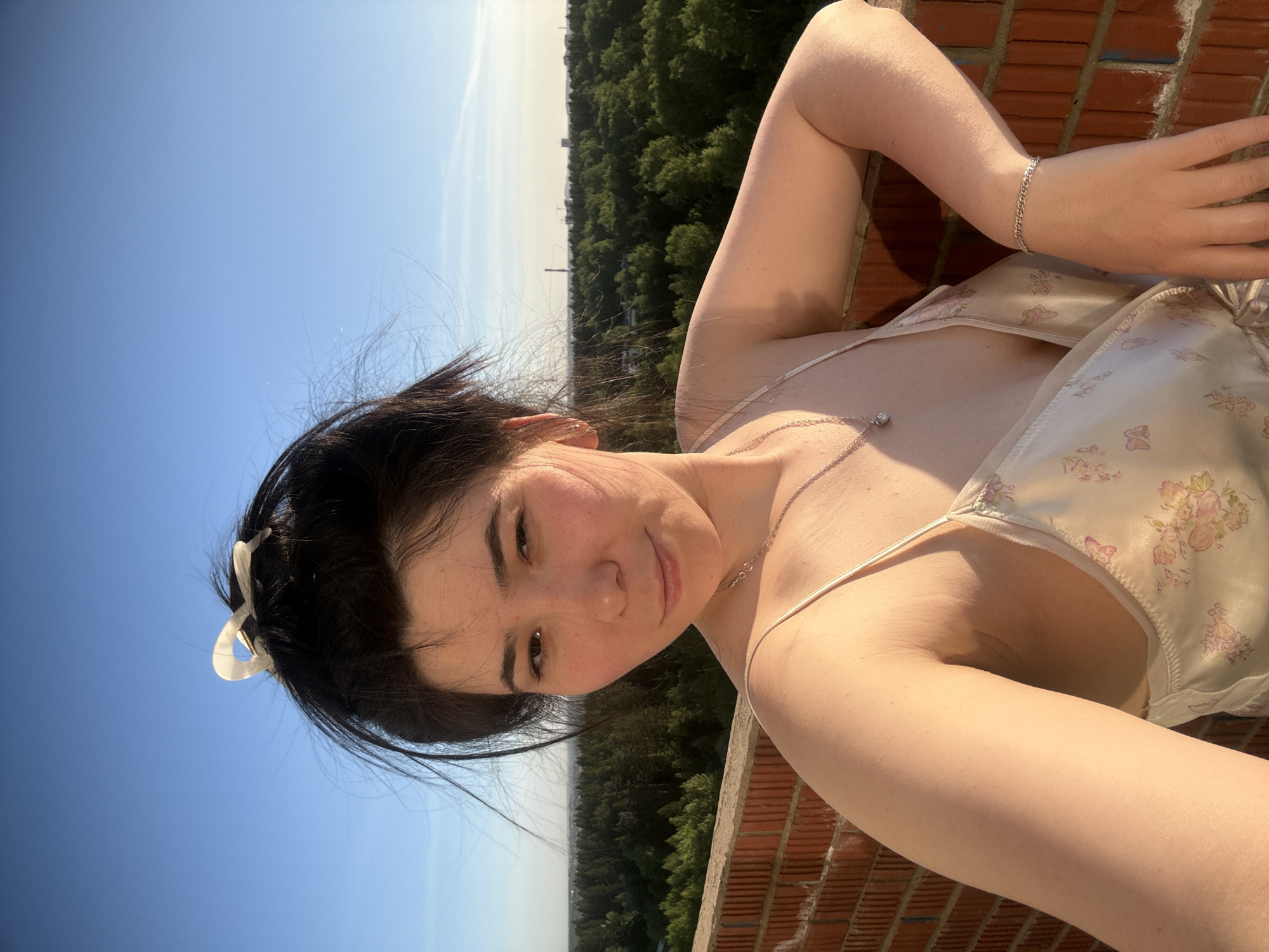 Woman documents afternoon in Izhevsk with selfies and cityscape photos