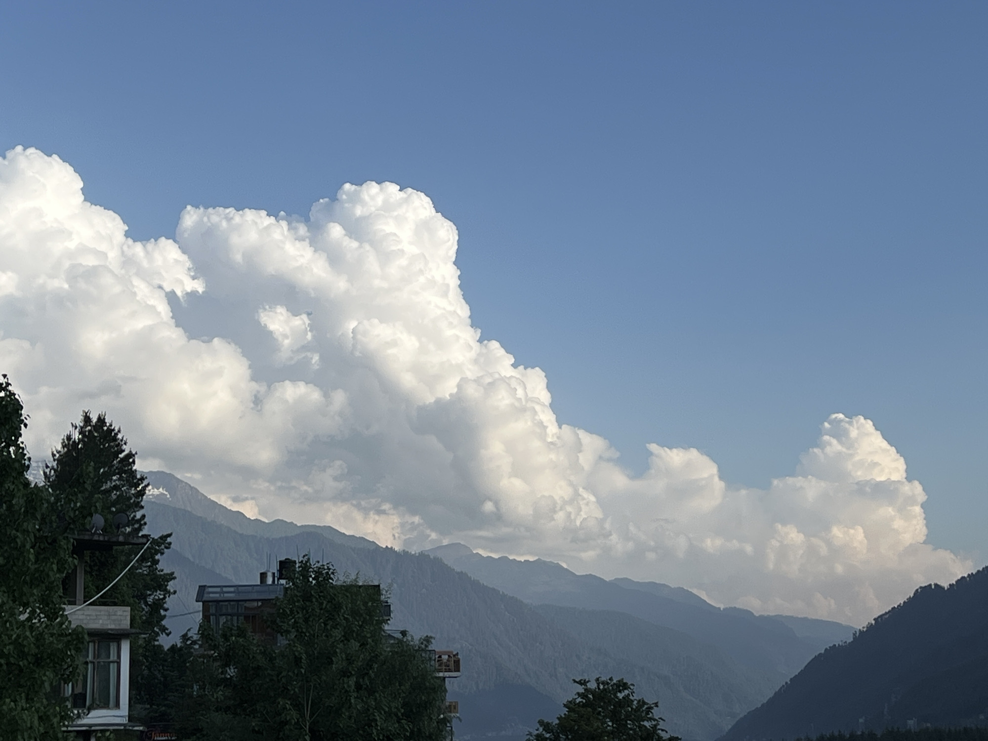 Tourist captures diverse Vashisht mountain village scenes during afternoon