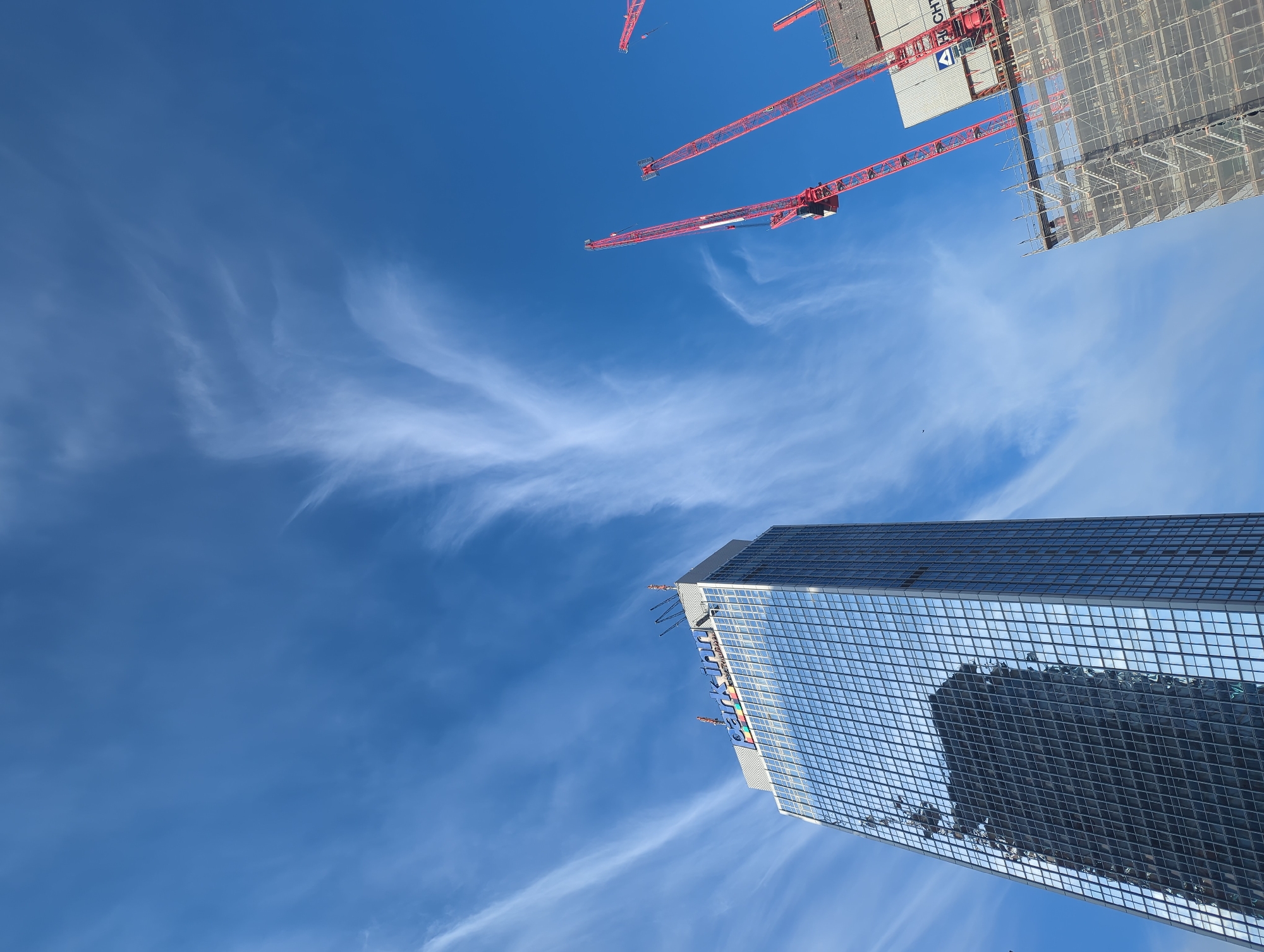 Modern glass skyscraper photographed from below in Berlin