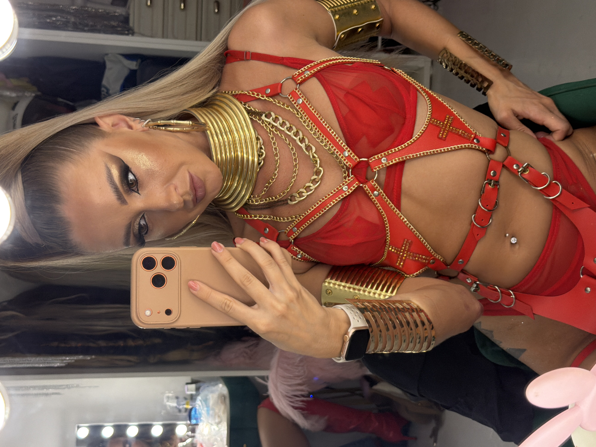 Red-lit Patong nightclub interior, mirror selfies in gold-accented lingerie
