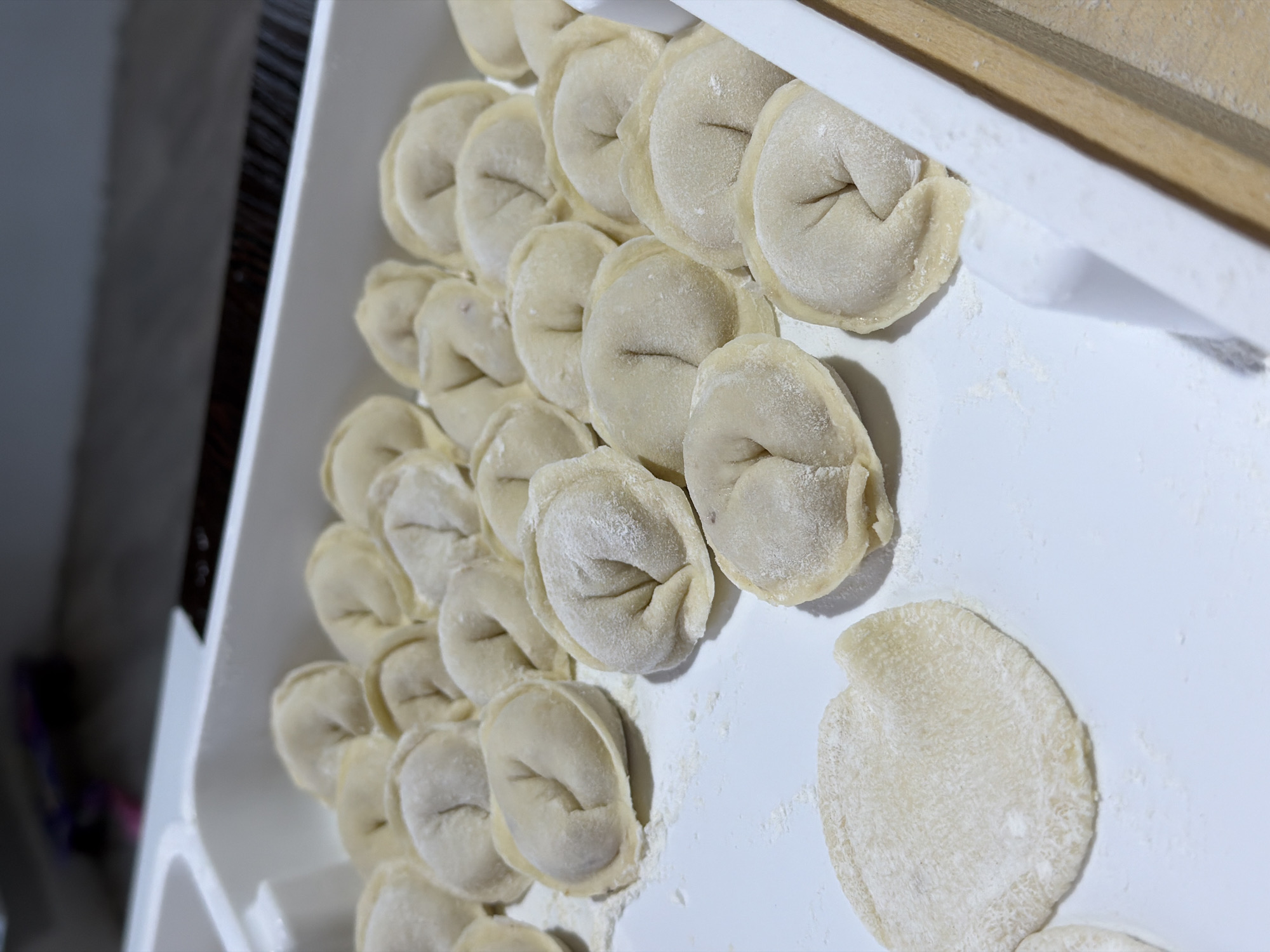 Woman makes homemade pelmeni dumplings in Chaikovsky, Russia