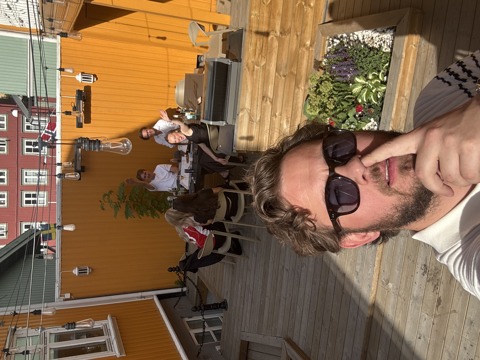 Outdoor social gathering features dining, crafting, beer balancing antics