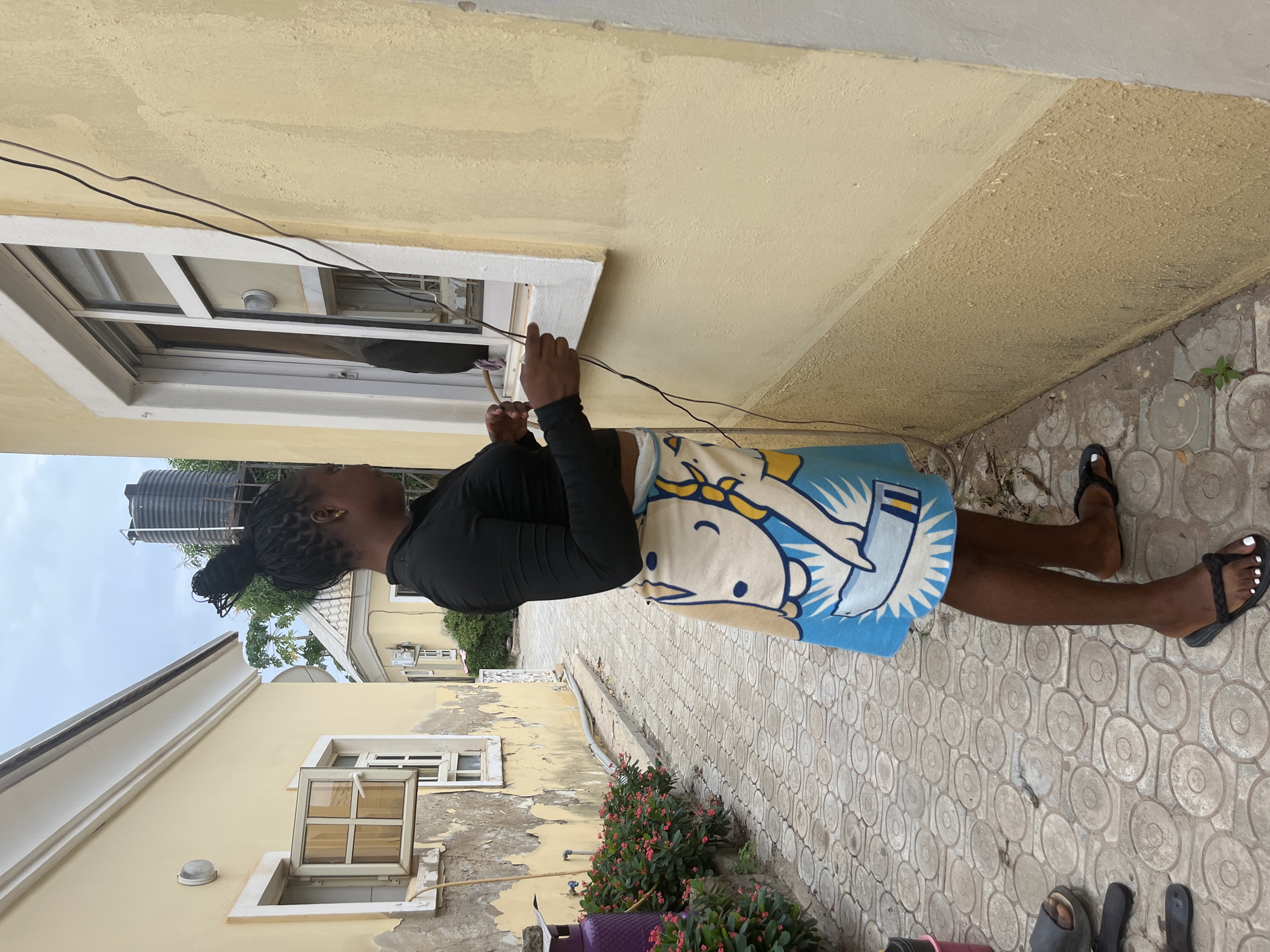 Daily life scenes from Abuja mixing indoor portraits and street cobbler work