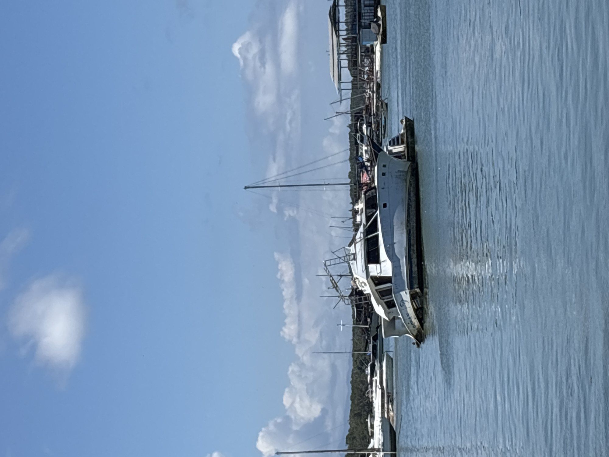 Boats docked at Denpasar harbor under morning skies