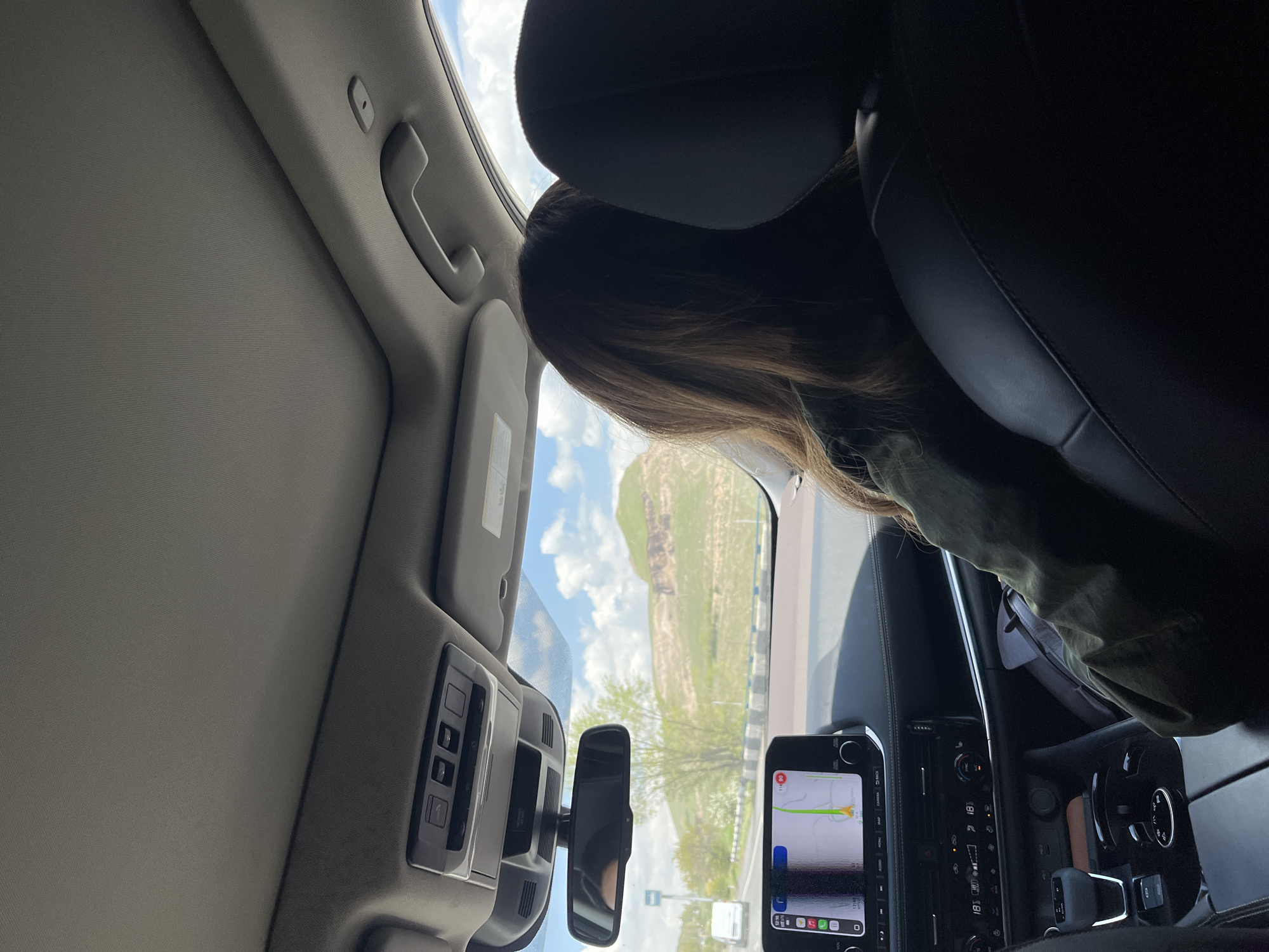 Vehicle passenger photographed on road near Arzni, Armenia