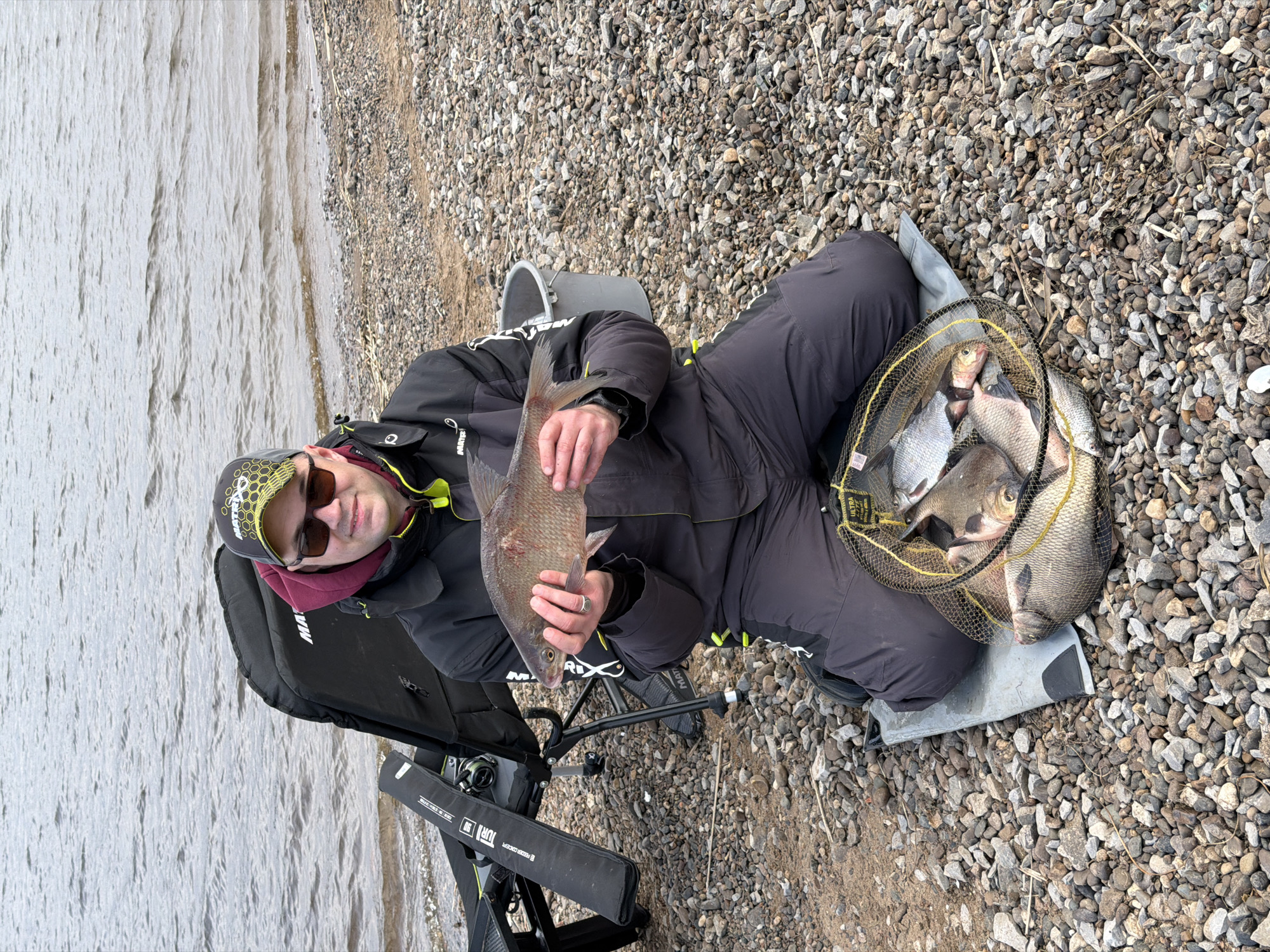 Man enjoys fishing outing on Chaykovsky shoreline