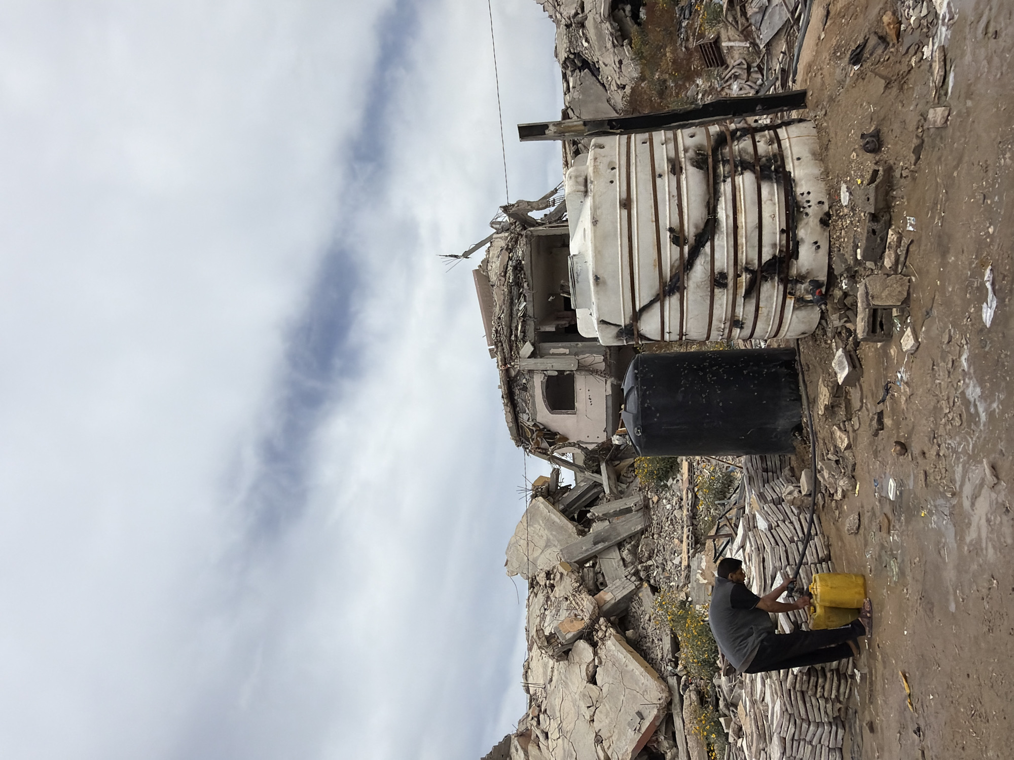 Gaza residents navigate daily life amid destruction, water collection