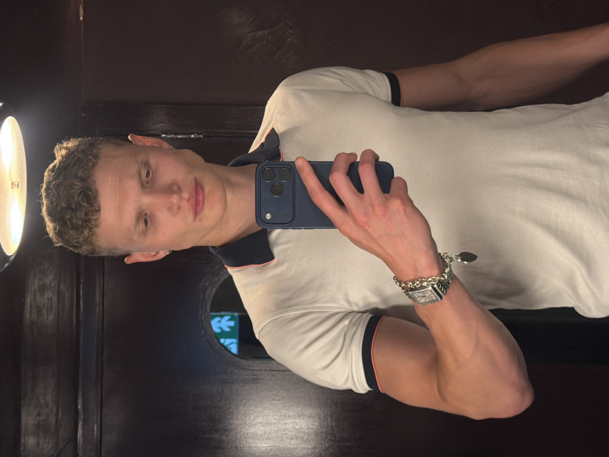 Young man documents evening dining experience at London restaurant