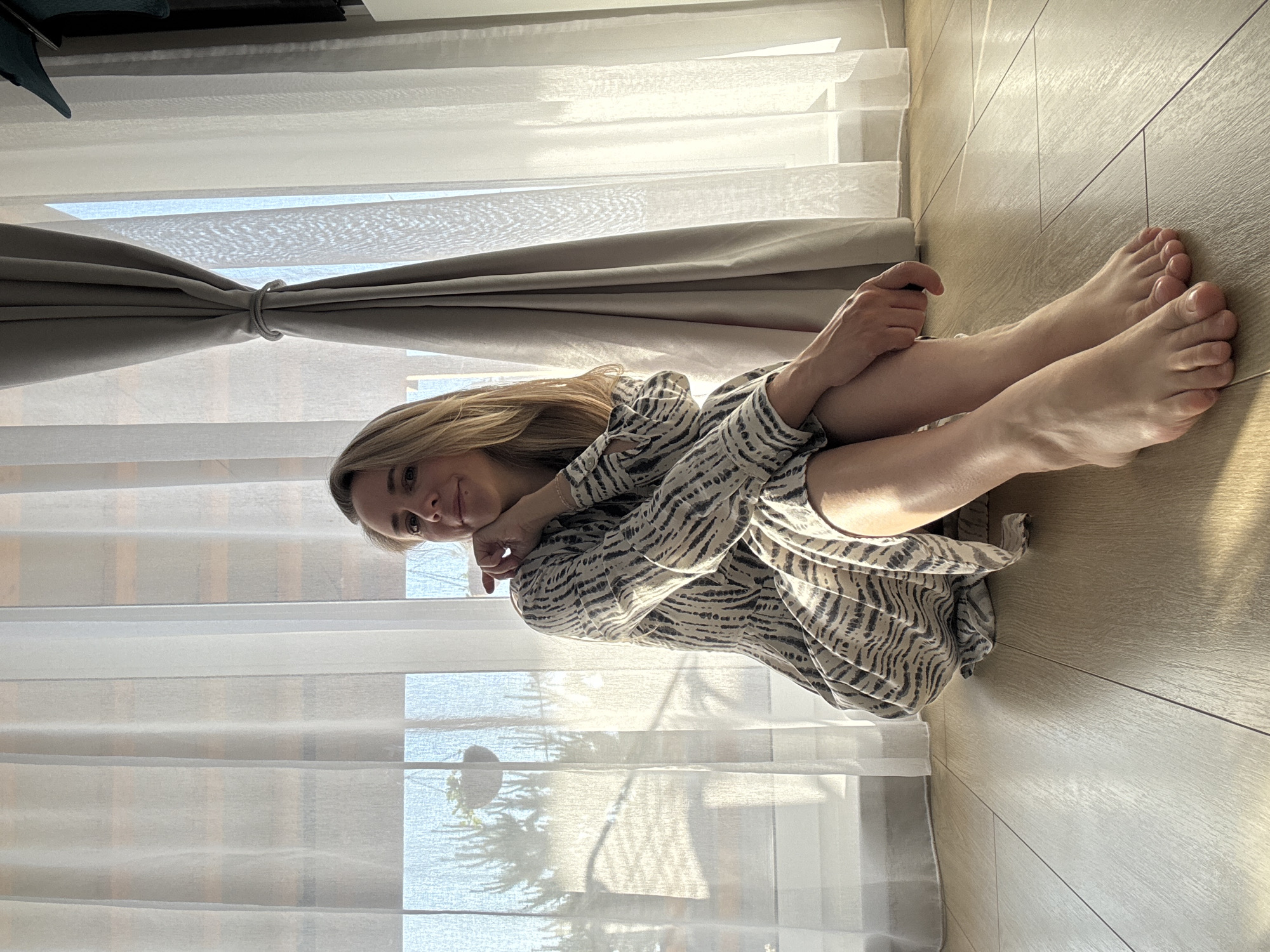Woman poses for indoor photo session in Chaikovsky, Russia