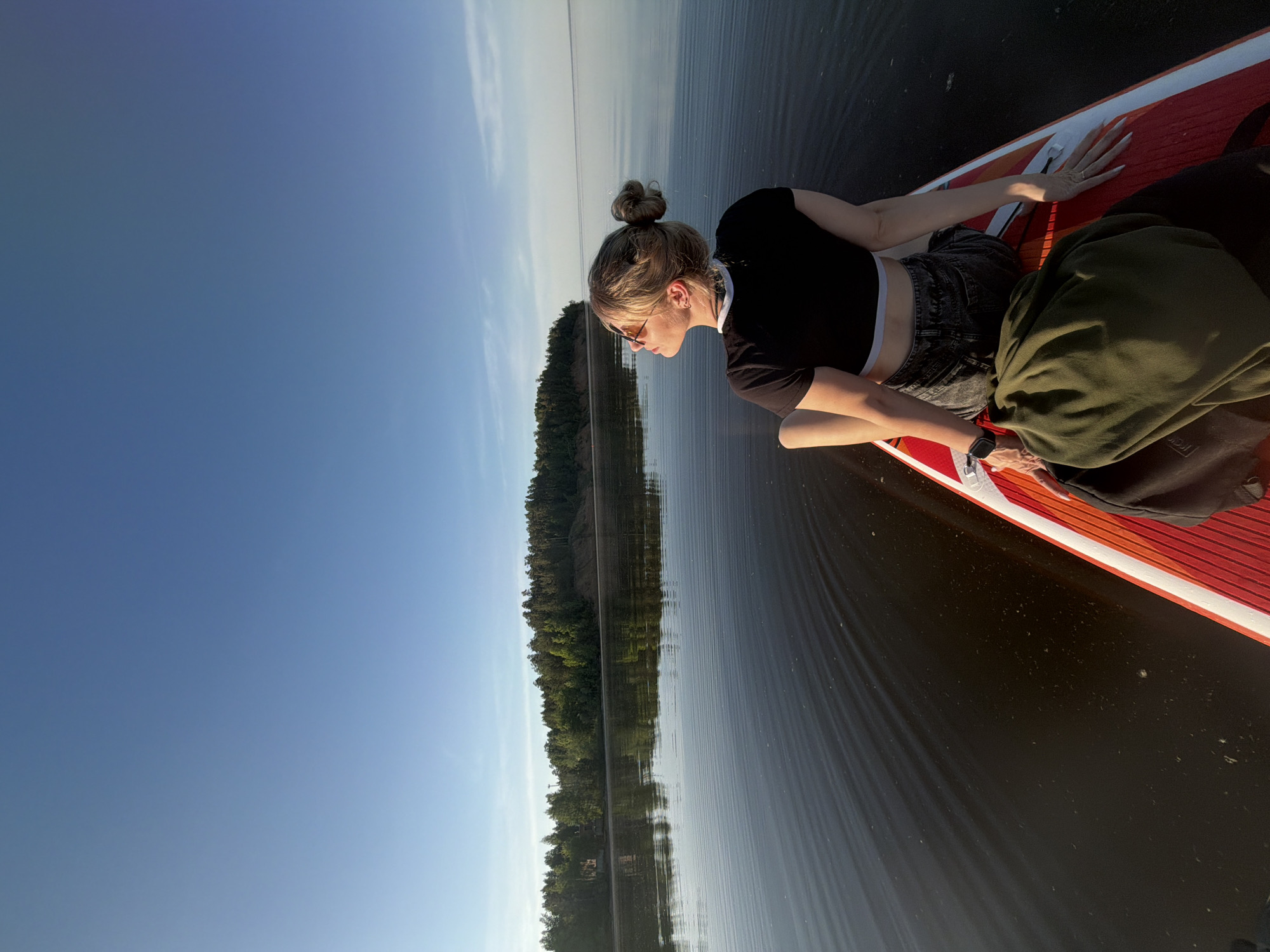 Couple enjoys afternoon paddleboarding session on Russian lake