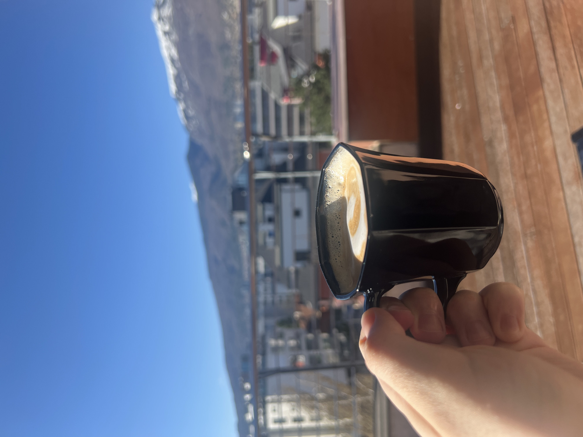 Morning coffee moment captured on Sofia balcony with mountain views