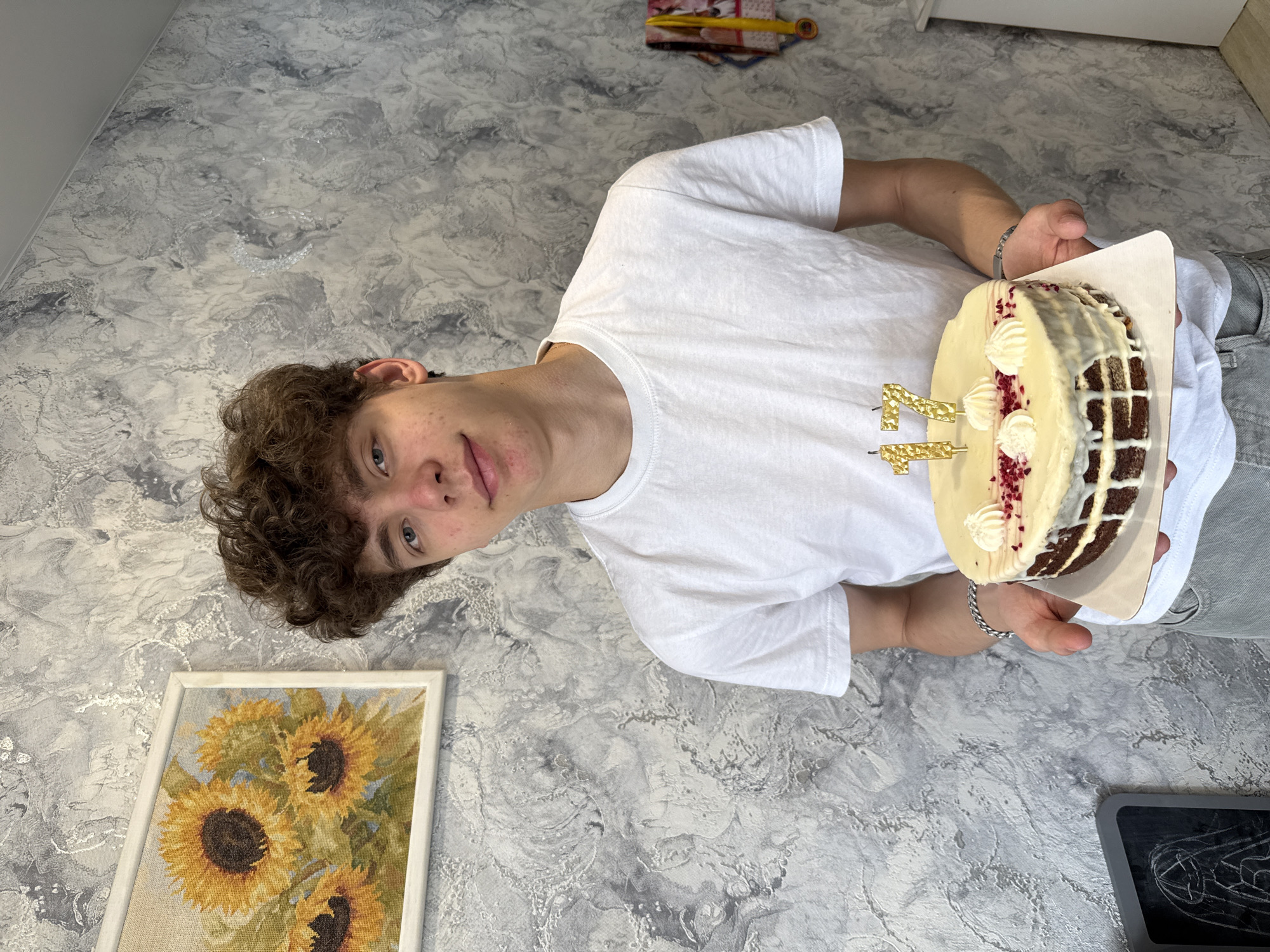 Person holds cake in room in Шебунино, Russia