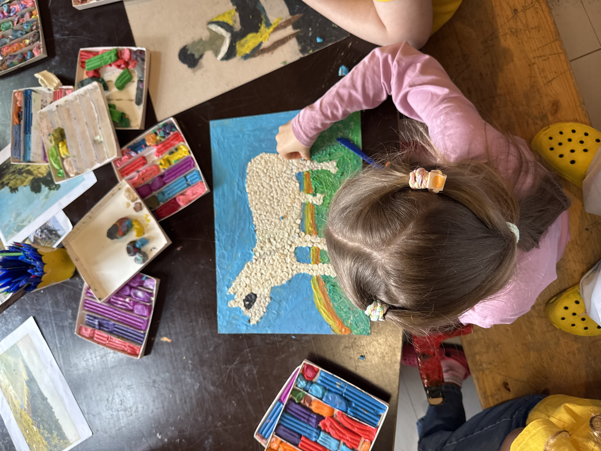 Kids' art workshop in Moscow, clay and painting on the table