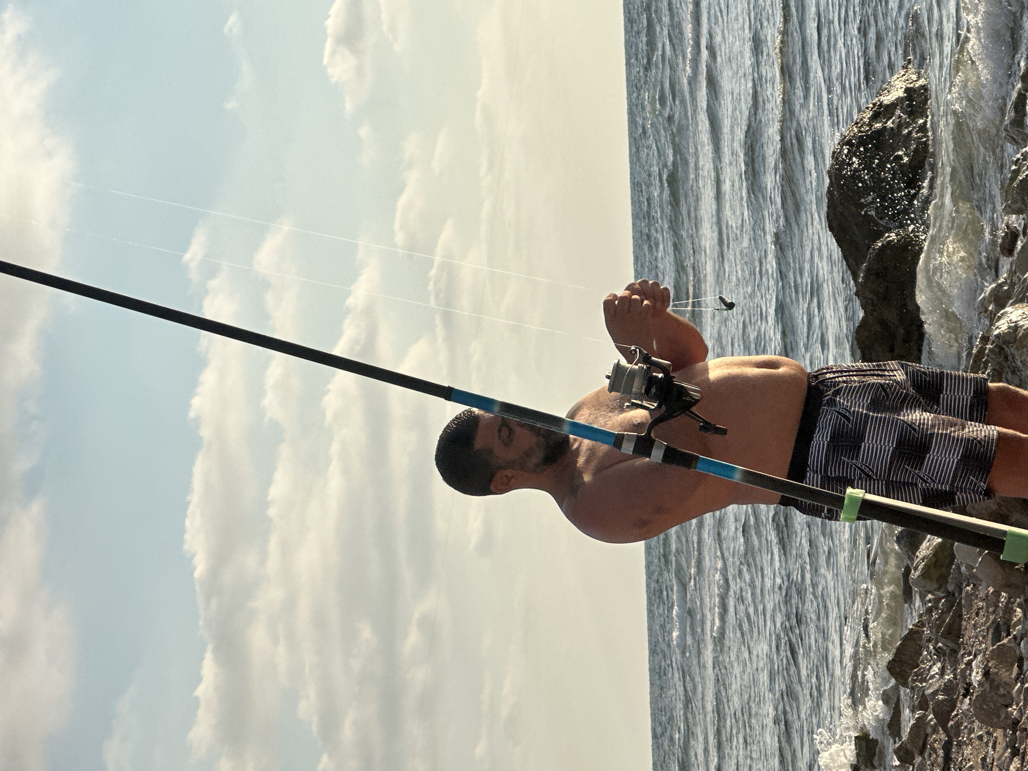 Lazy afternoon fishing and beers on Haifa's rocky shore