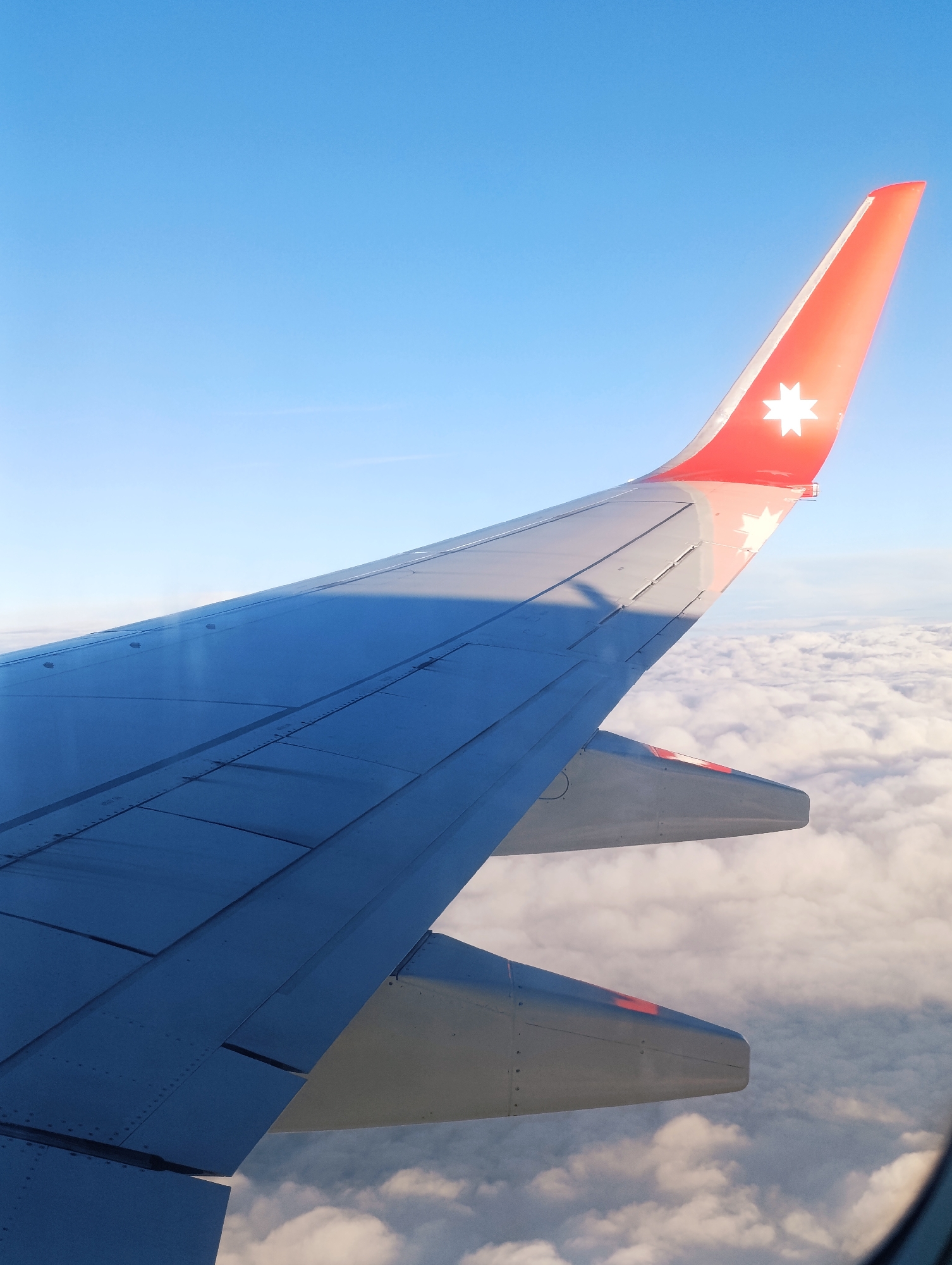 Mother, child document sunset flight over Russia with photos