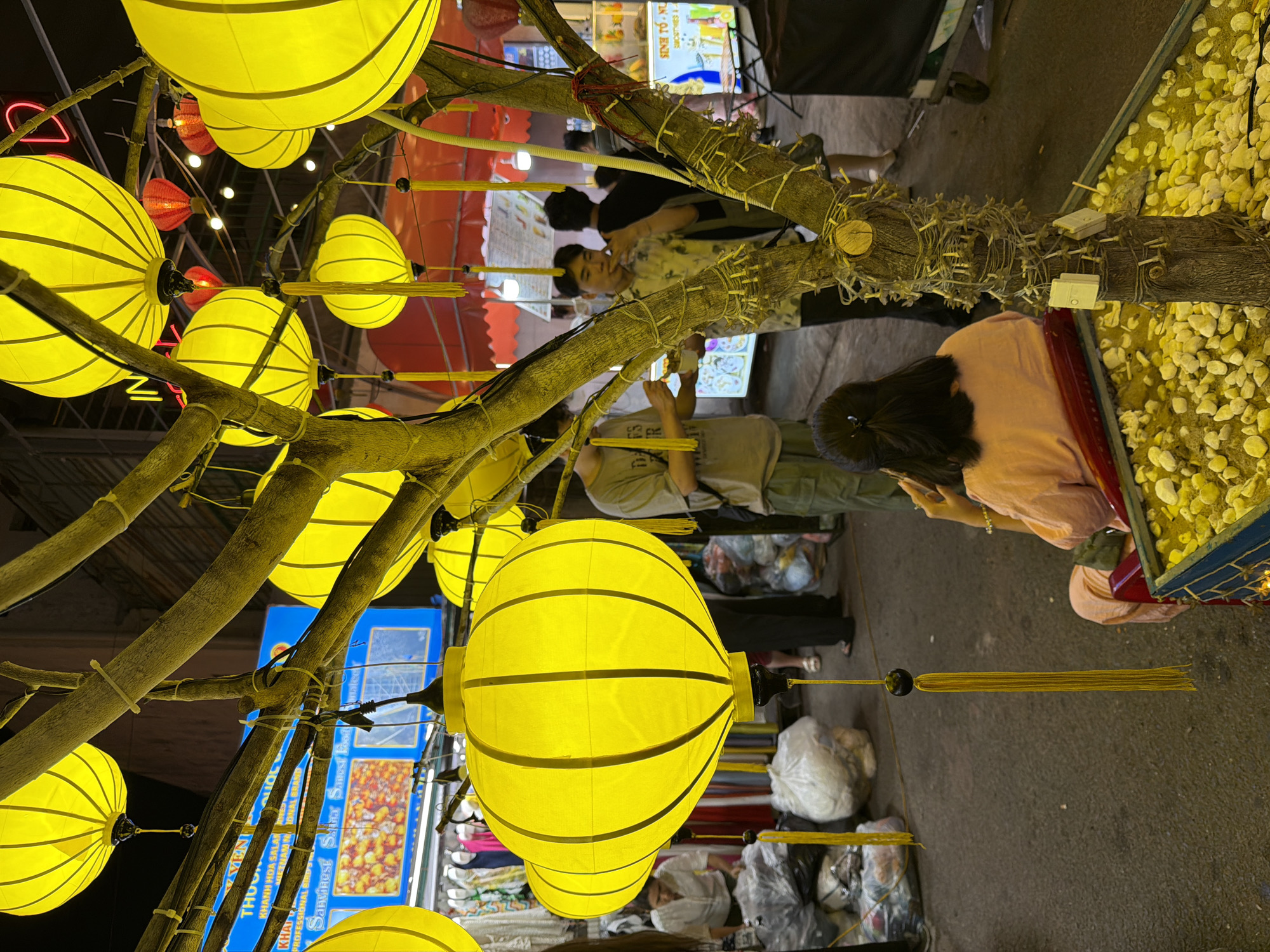 Nha Trang night market glowing under yellow lanterns