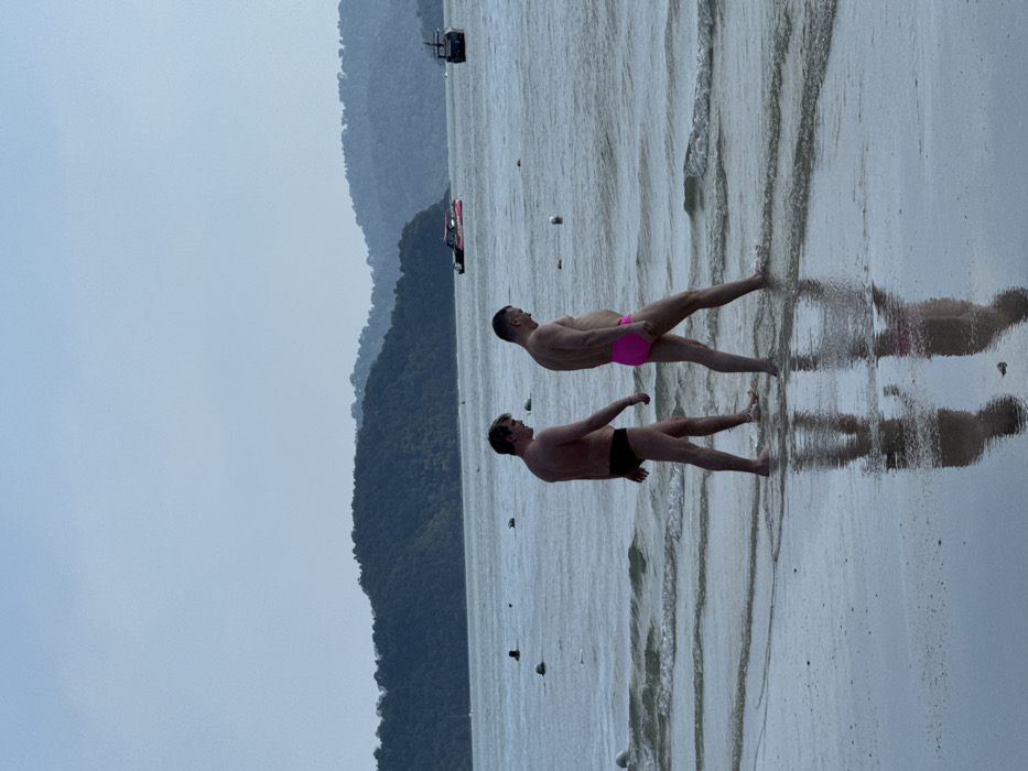 Tourists enjoy sunny morning activities at Malaysia's Cenang Beach