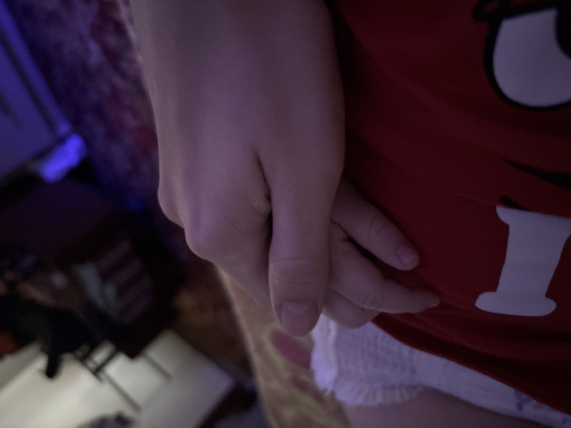 Infant in M&M onesie photographed in Barysaw, Belarus