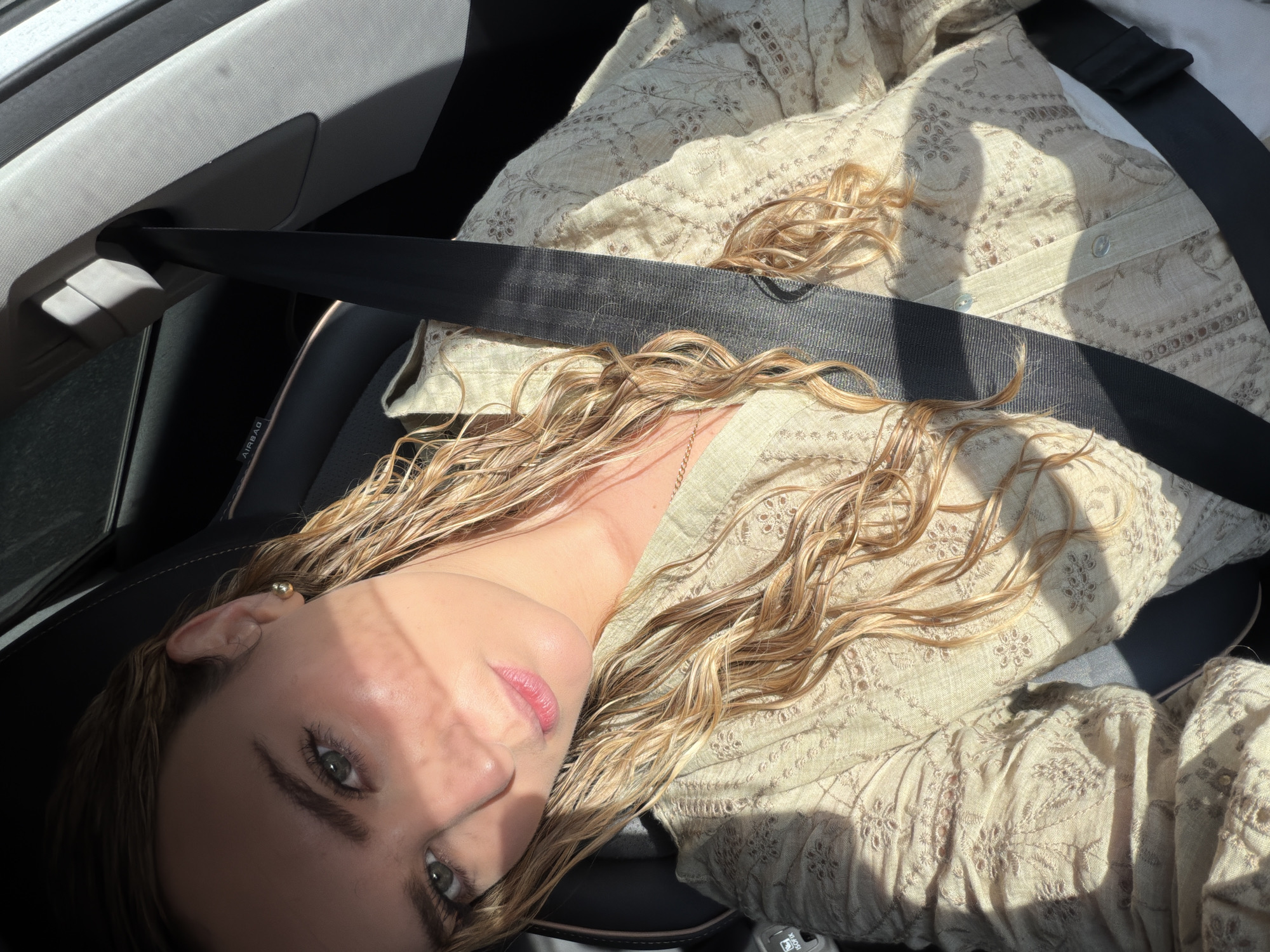 Woman observed seated in vehicle interior in Puebla