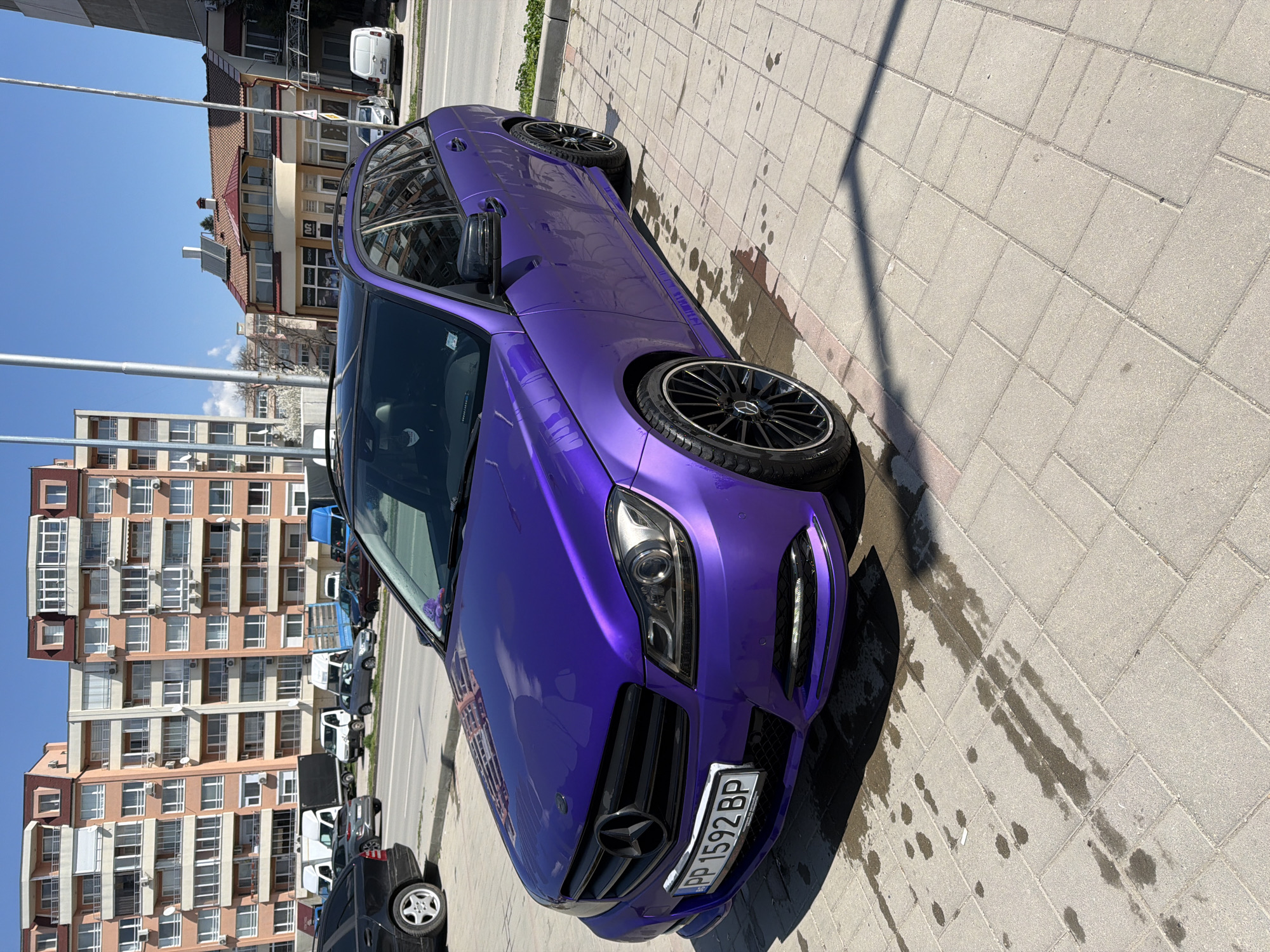 Purple Mercedes spotted parked on sidewalk in Razgrad, Bulgaria
