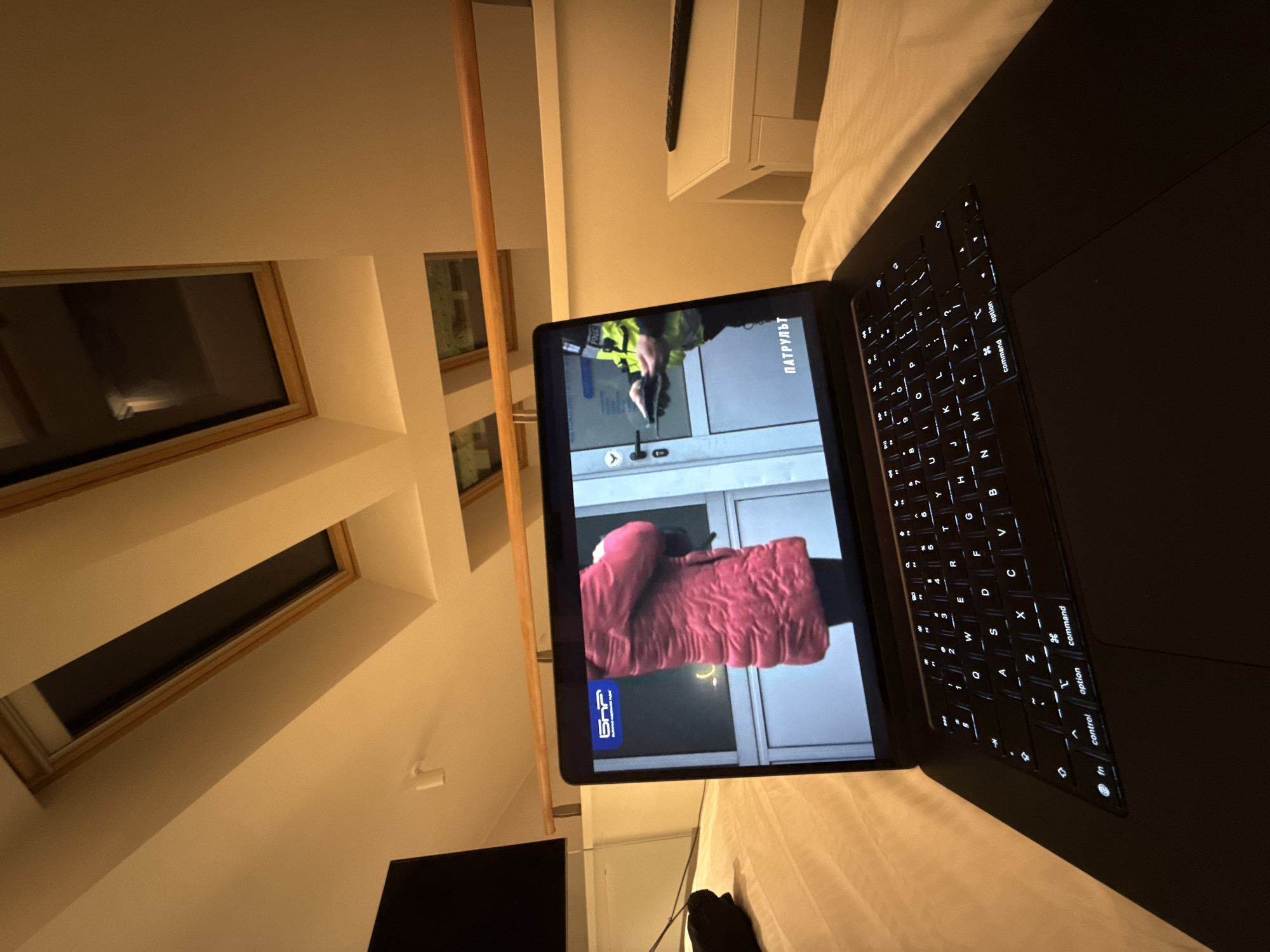 Laptop user in Budapest views Russian news, code
