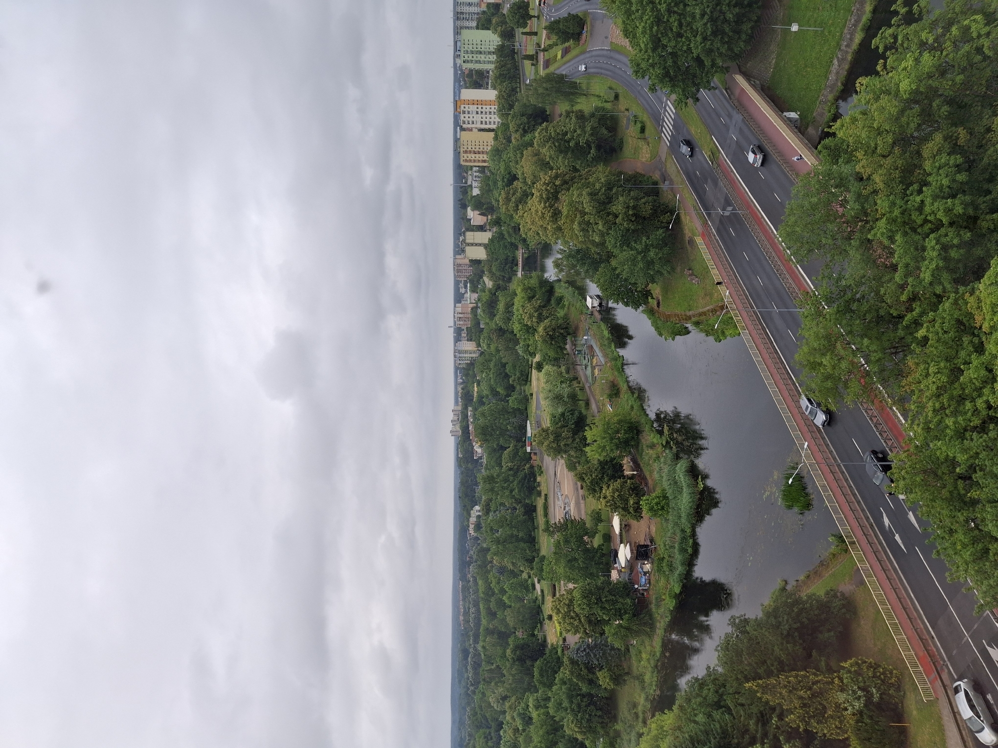 Aerial view of Piła's urban landscape, greenery, and waterway