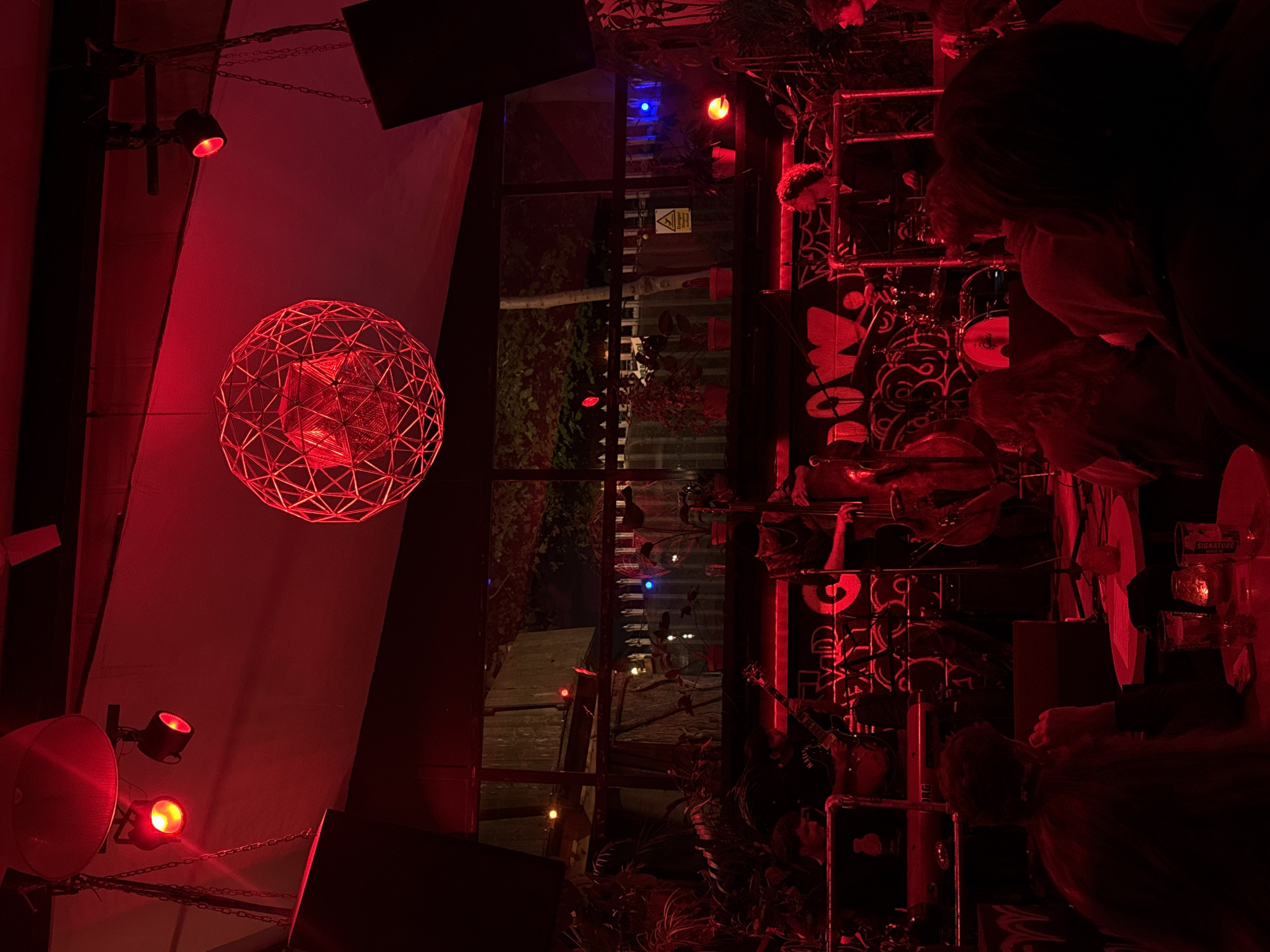 London venue interior captured with distinctive red geodesic lighting