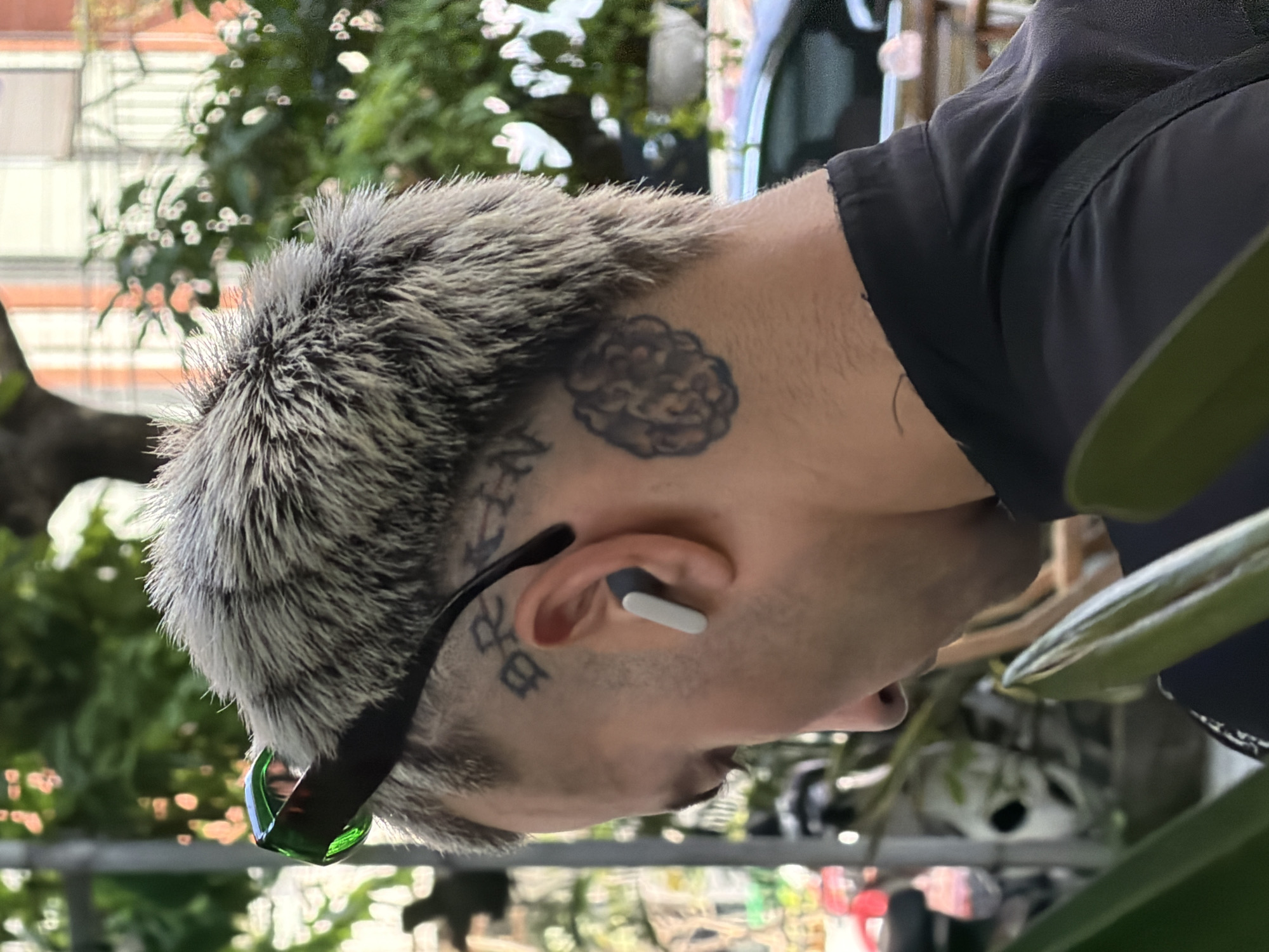 Morning scenes captured at Đà Nẵng cafe with tattooed patron