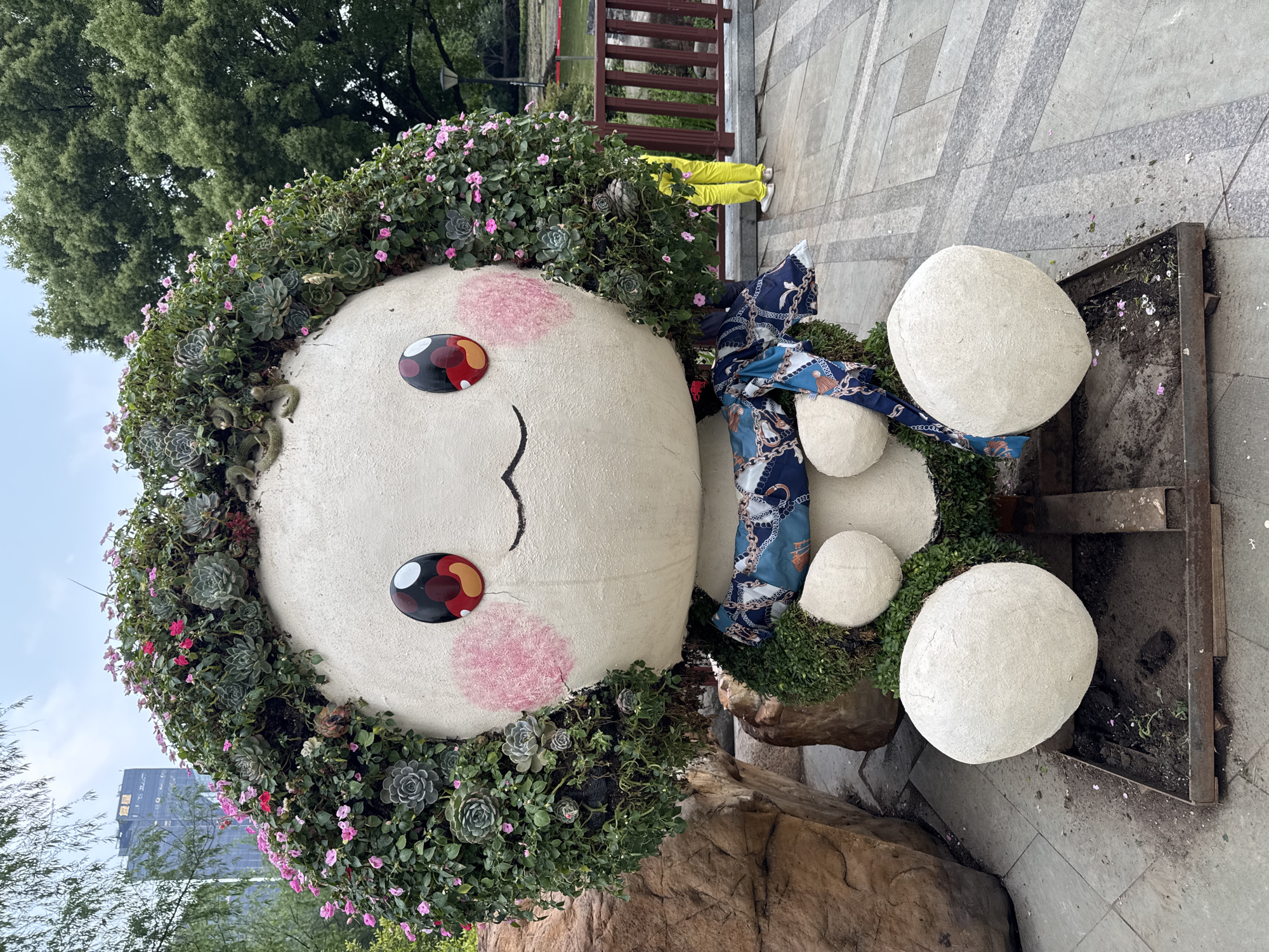 Garden scenes documented in Shanghai featuring sculptures and pond