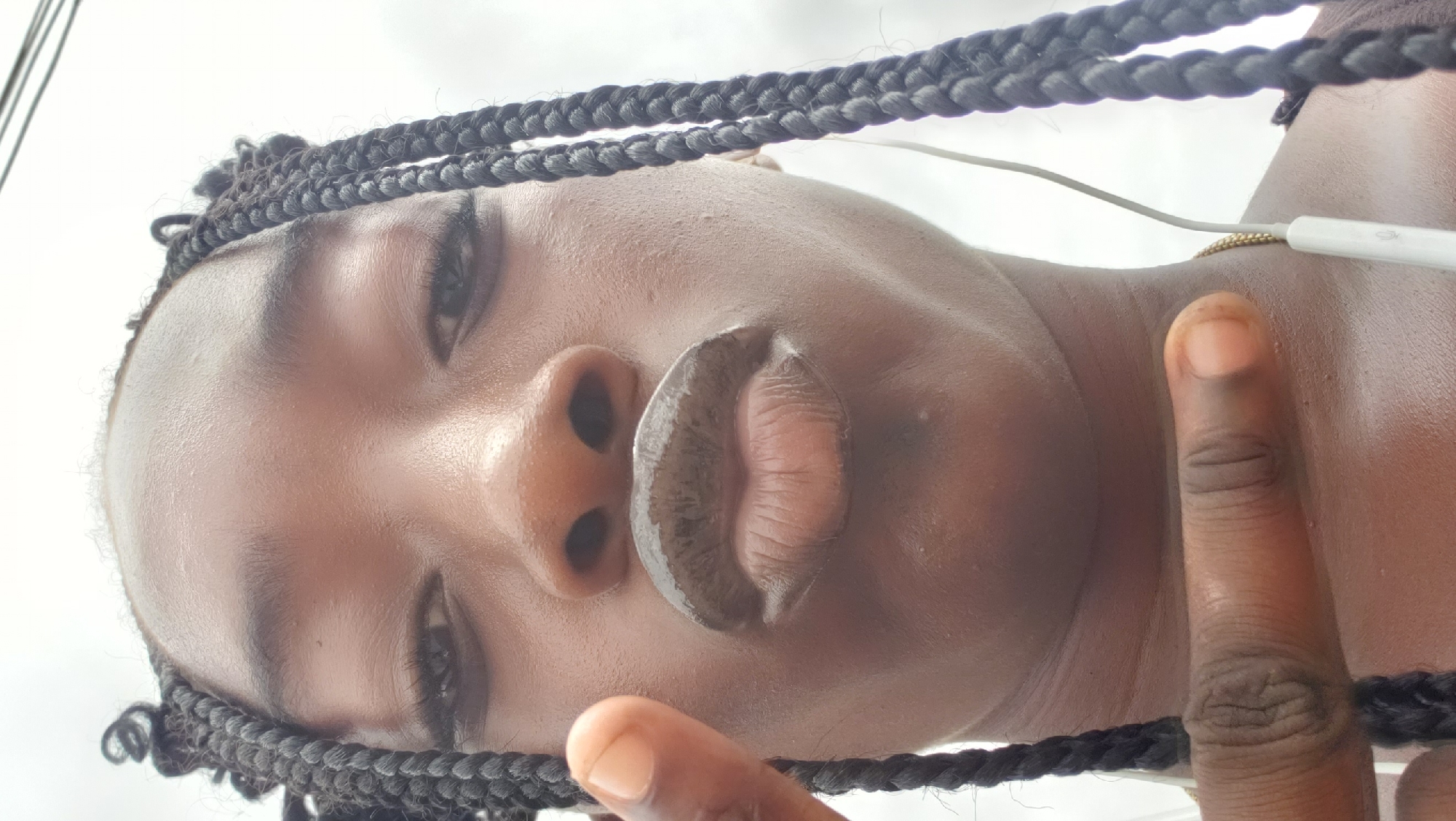 Woman takes selfie, street photos in Rido Nigeria